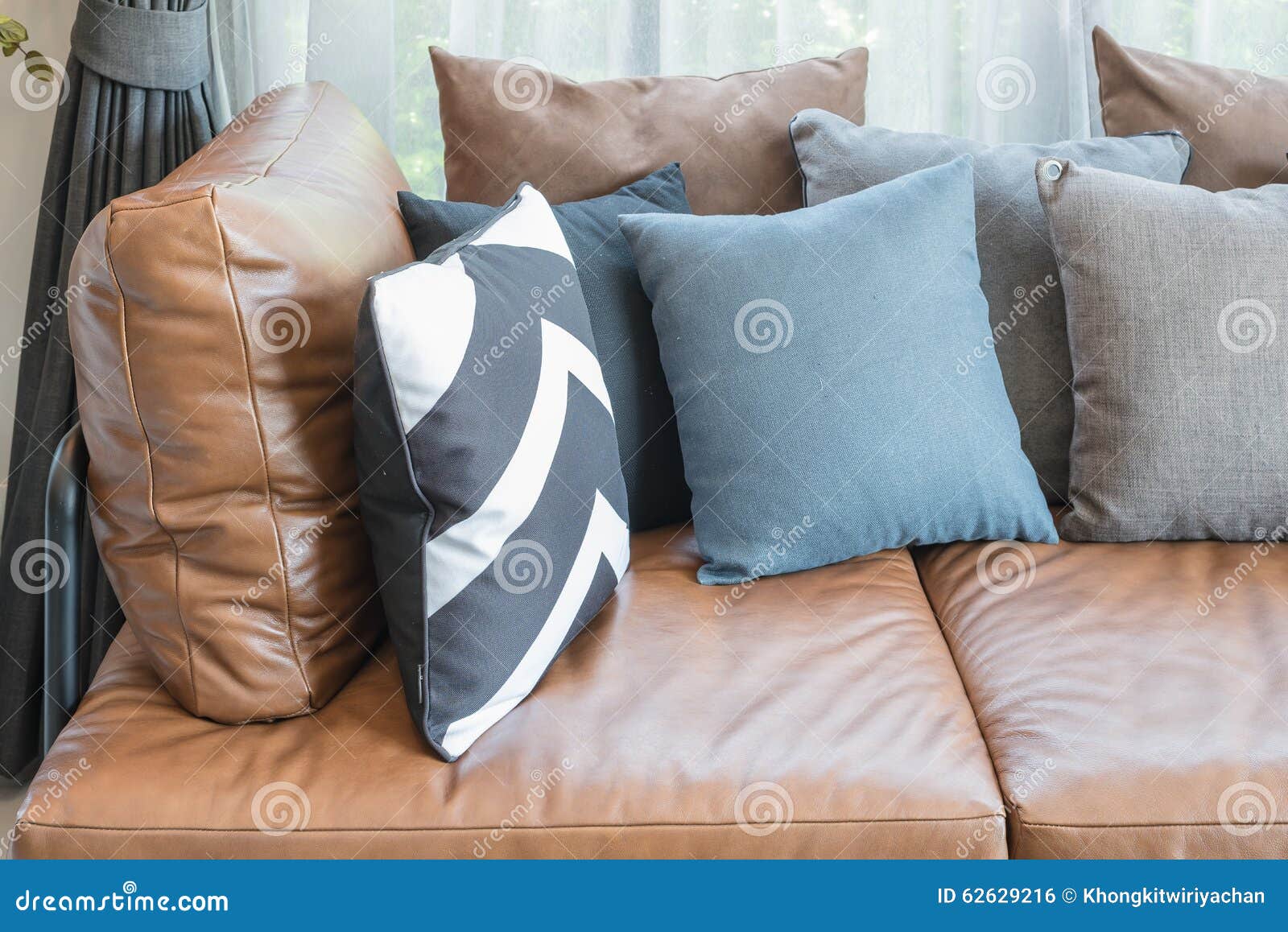 Pillows on Brown Leather Sofa Stock Photo Image of decor, light 62629216