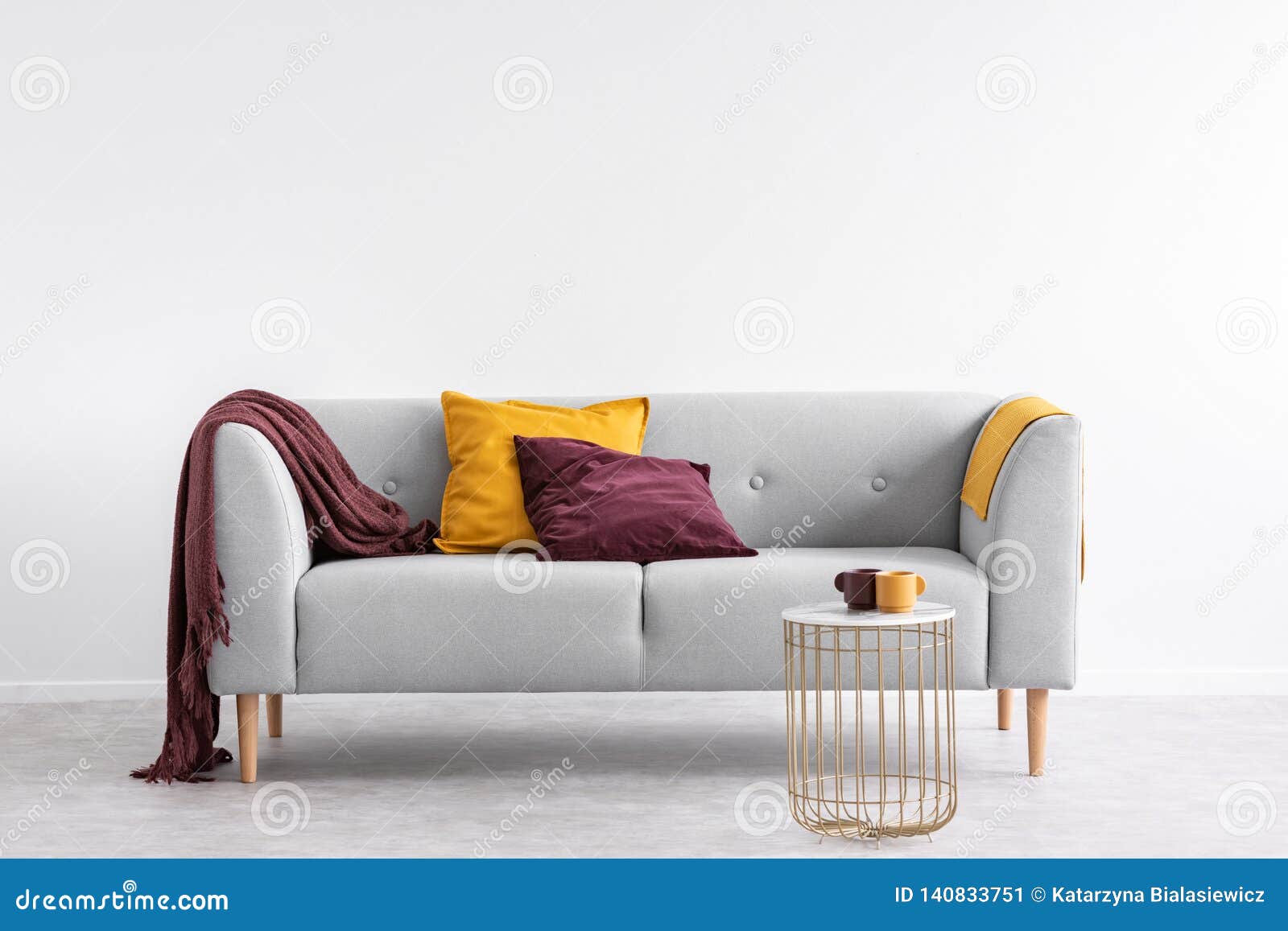 https://thumbs.dreamstime.com/z/pillows-purple-blanket-grey-sofa-white-living-room-interior-gold-table-real-photo-pillows-purple-blanket-140833751.jpg