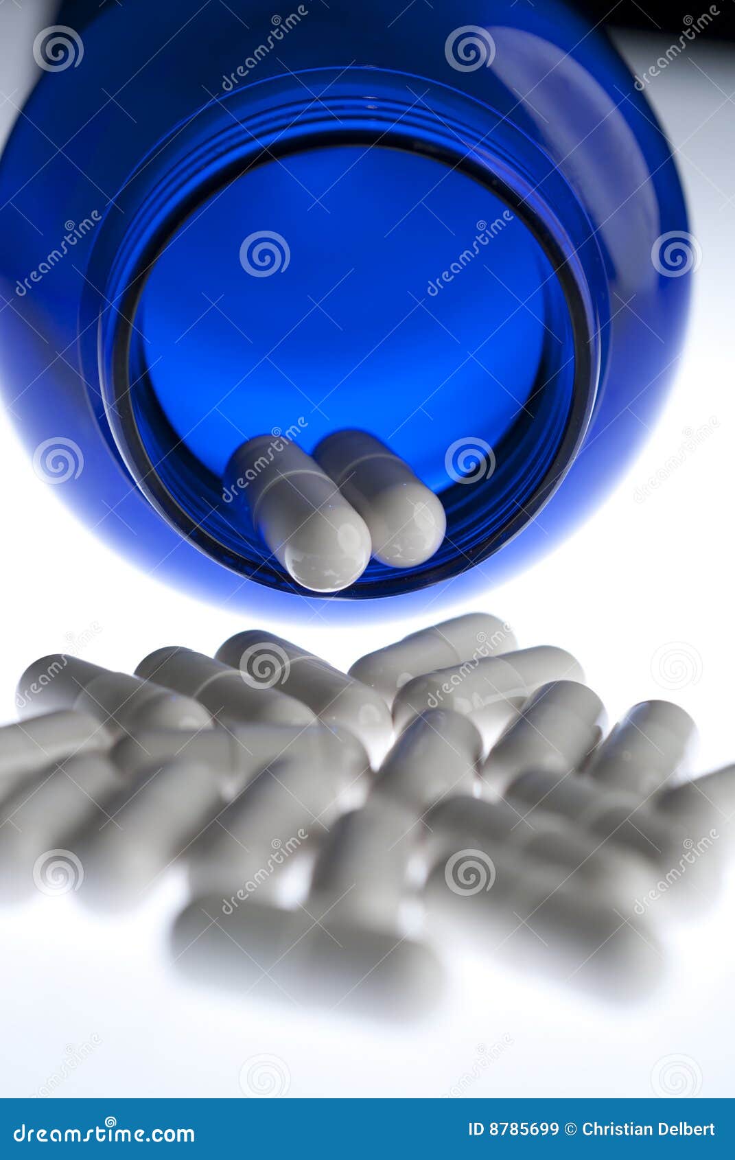Pills in Blue Bottle Vertical Stock Image Image of pills, medicine