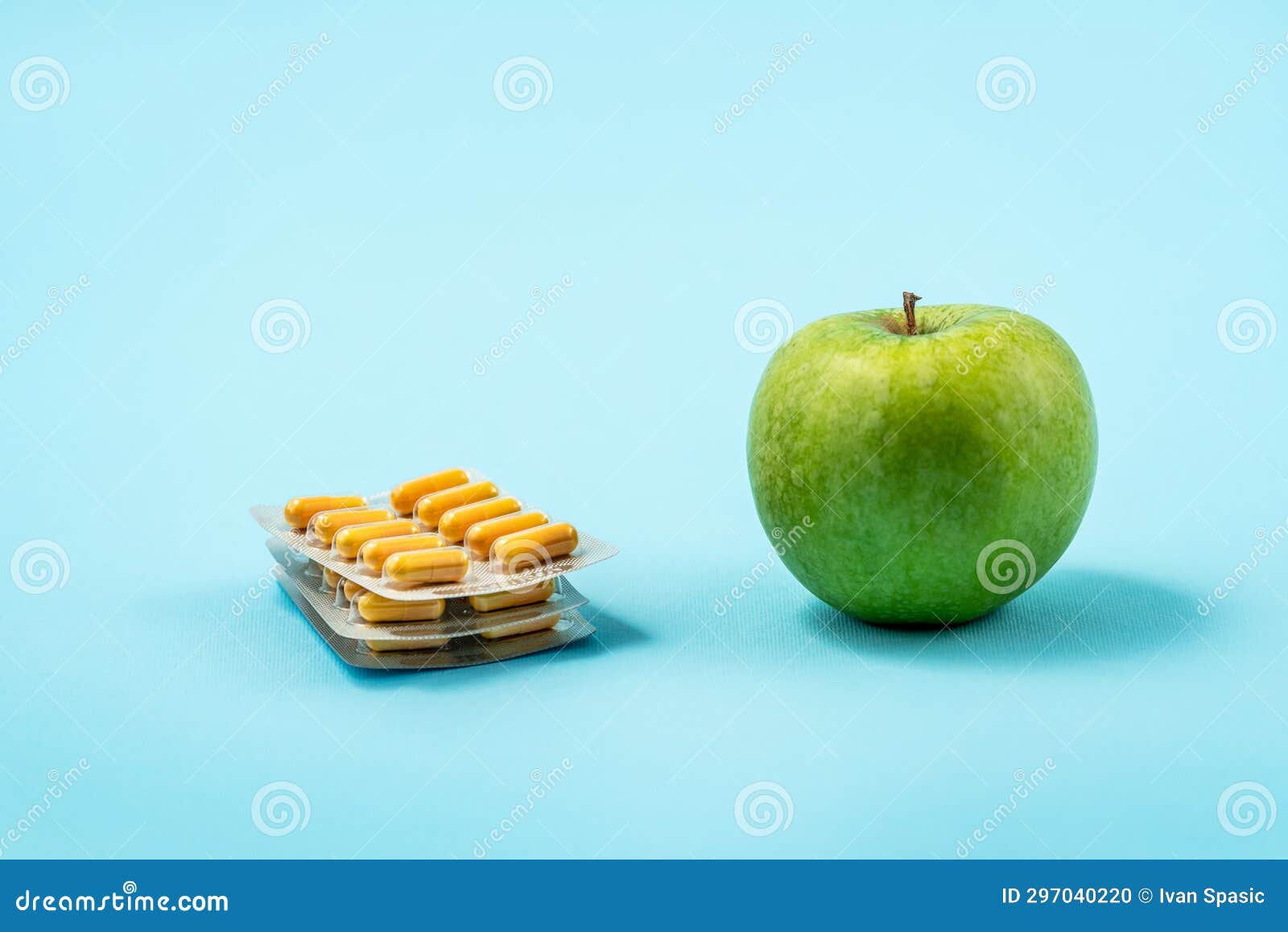 pills capsules and apples