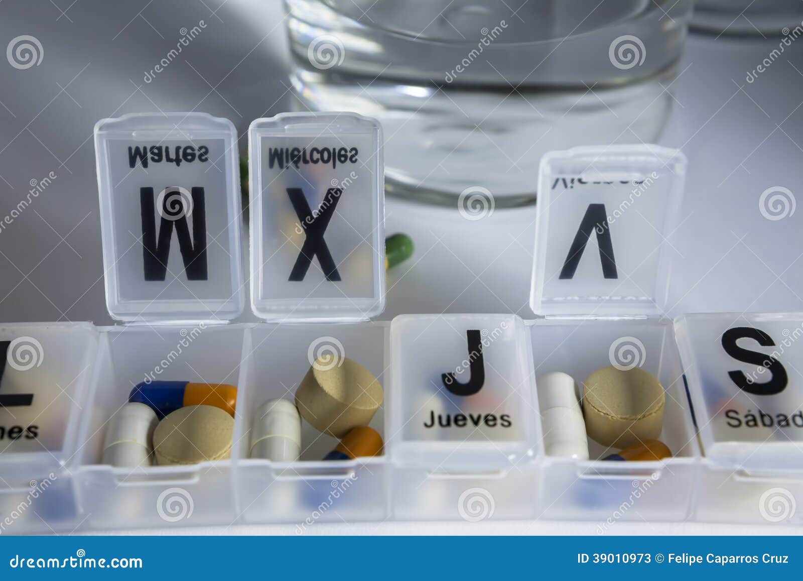 Pills with pill organizer stock image. Image of health 39010973