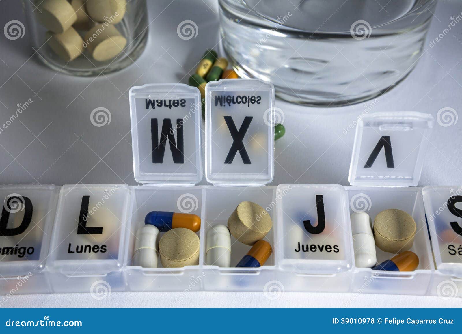 Pills with pill organizer stock photo. Image of active 39010978