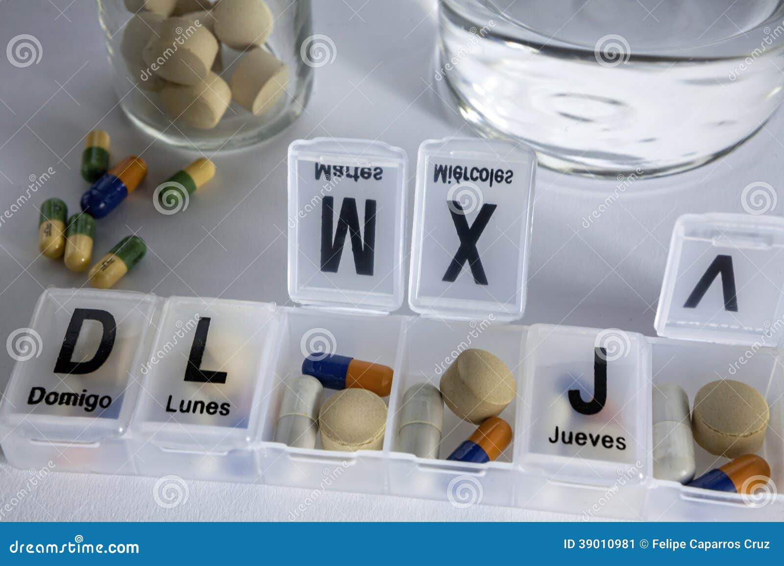 Pills with pill organizer stock image. Image of pharmacy 39010981