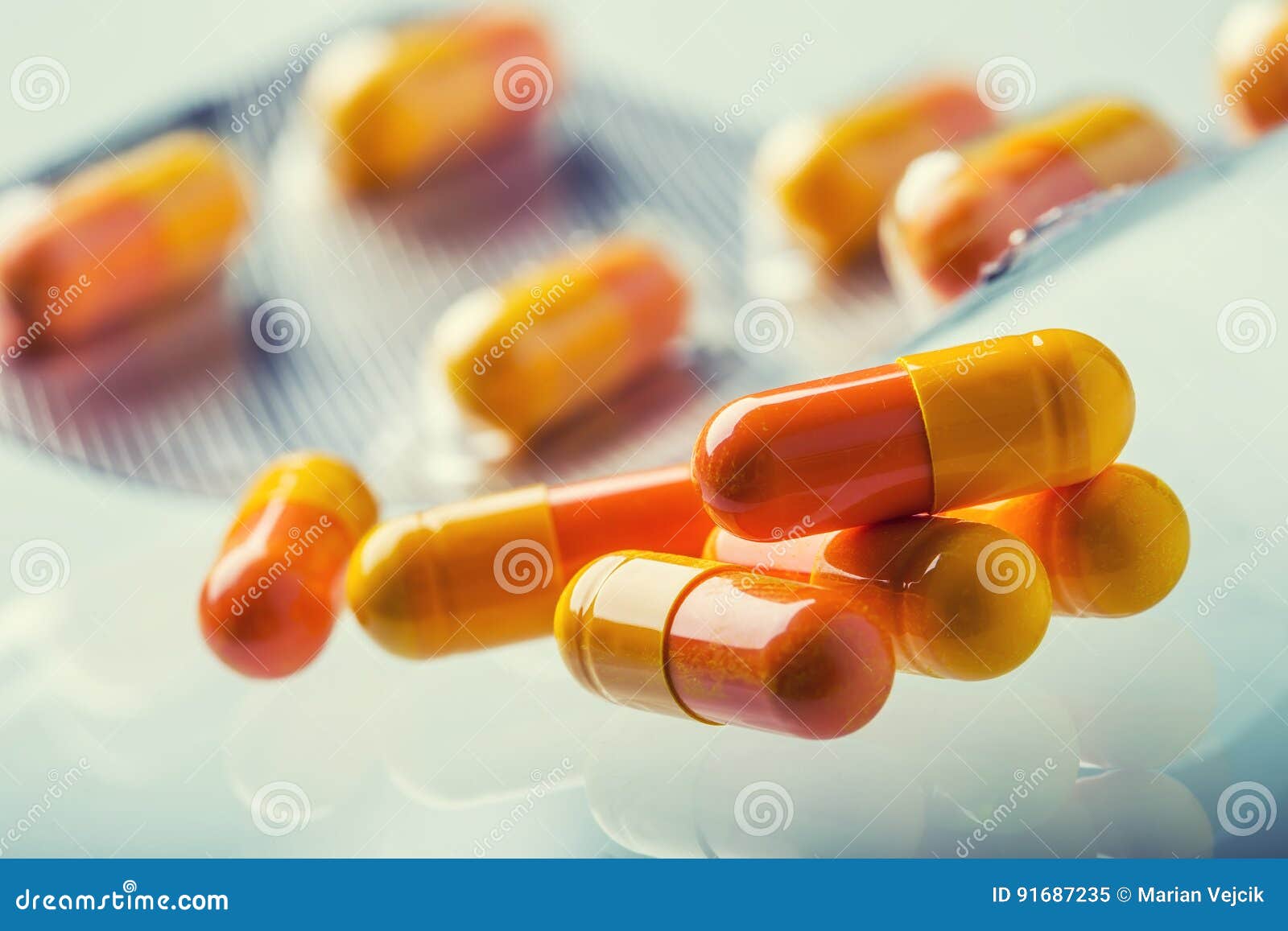pills tablets capsule or medicament freely laid on glass background
