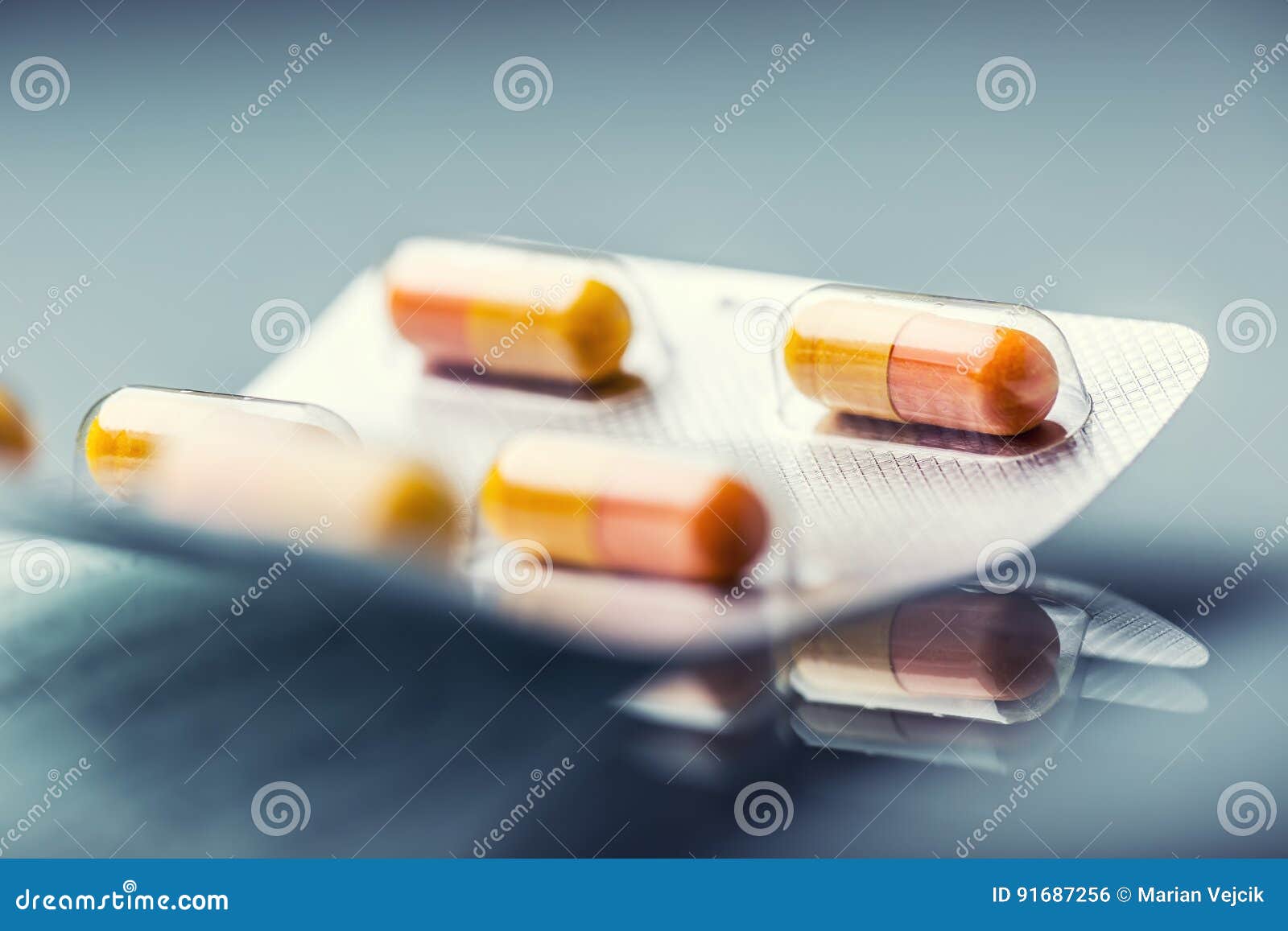 pills tablets capsule or medicament freely laid on glass background