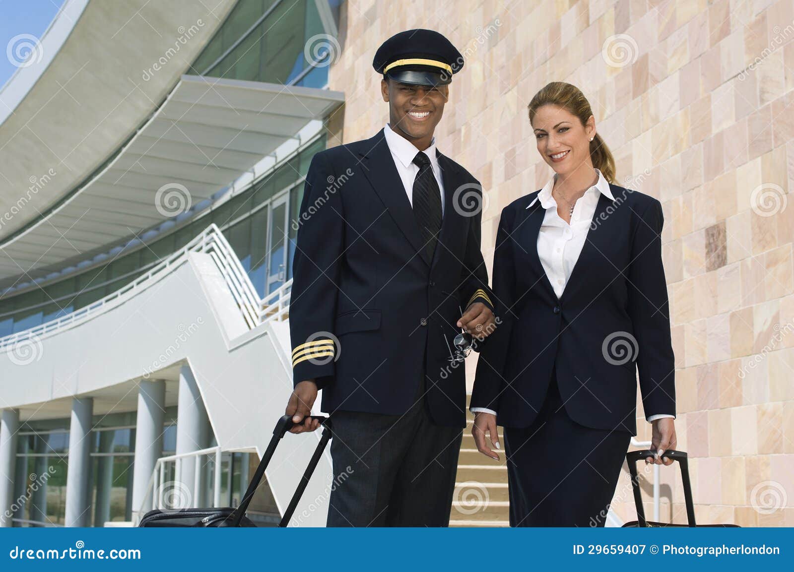pilot and flight attendant outside building