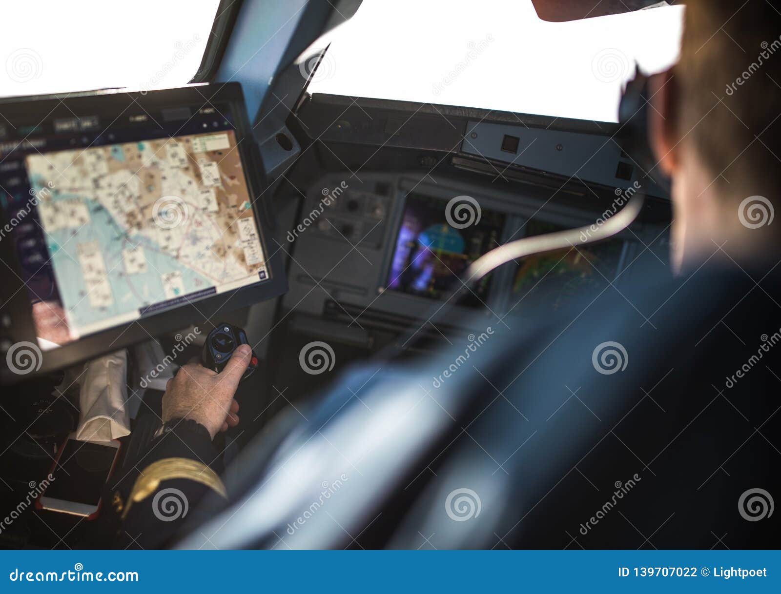 pilot`s hand accelerating on the throttle in airplane flight cockpit during takeoff
