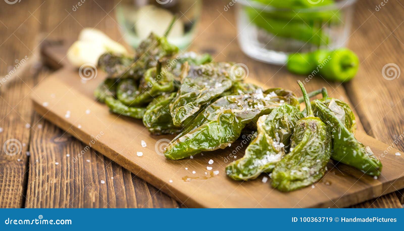 fresh made pimientos de padron on a rustic background