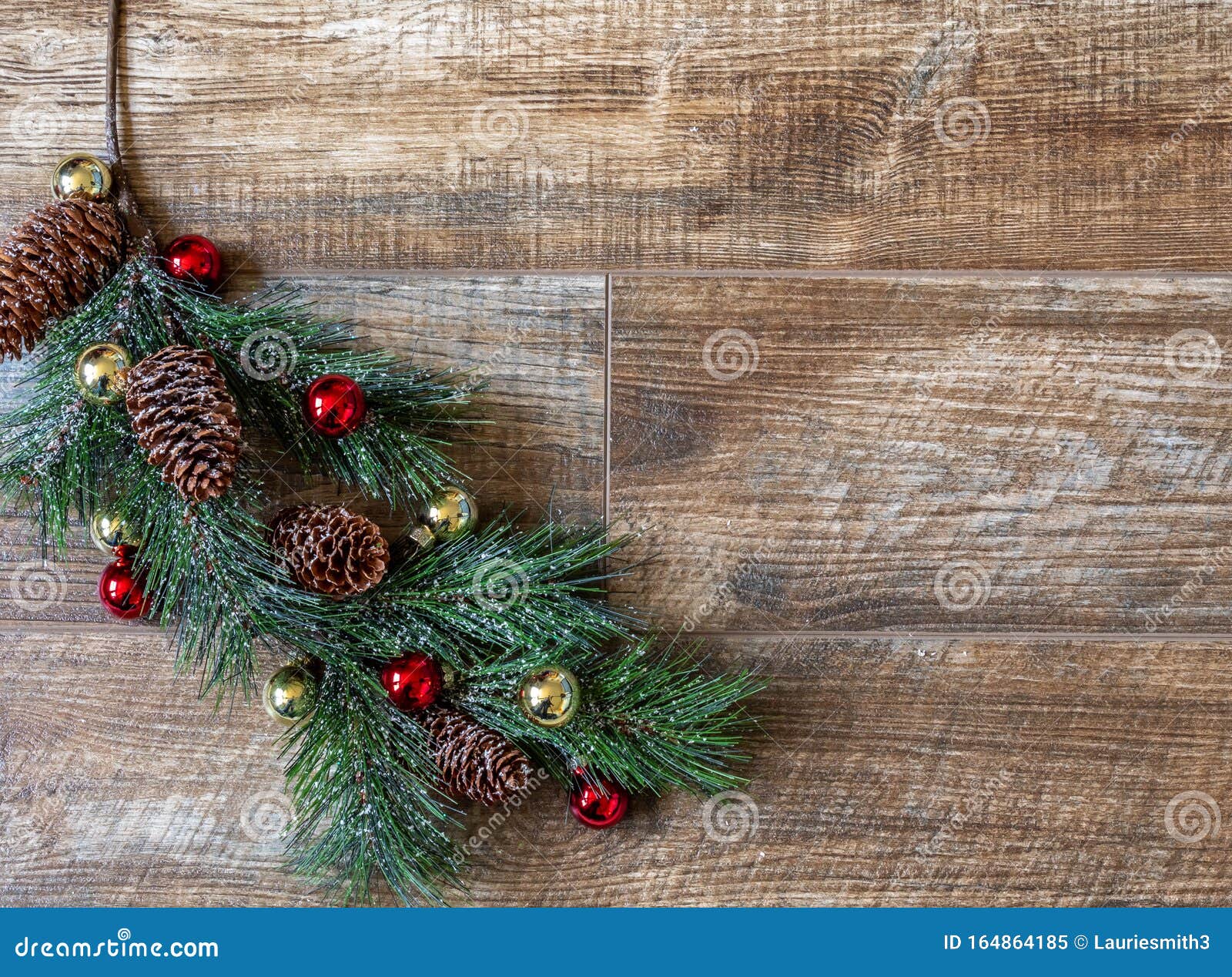 Pine Bough with Pine Cones, Red/ Gold Ornaments on Rustic Wood ...