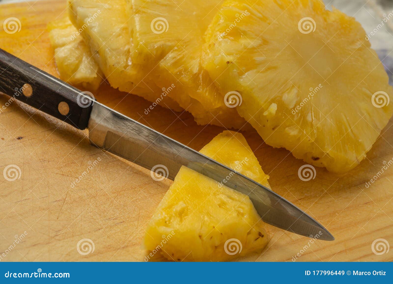 Pineapple Cut into Slices, on a Fruit Chopping Board, Kitchen Knife