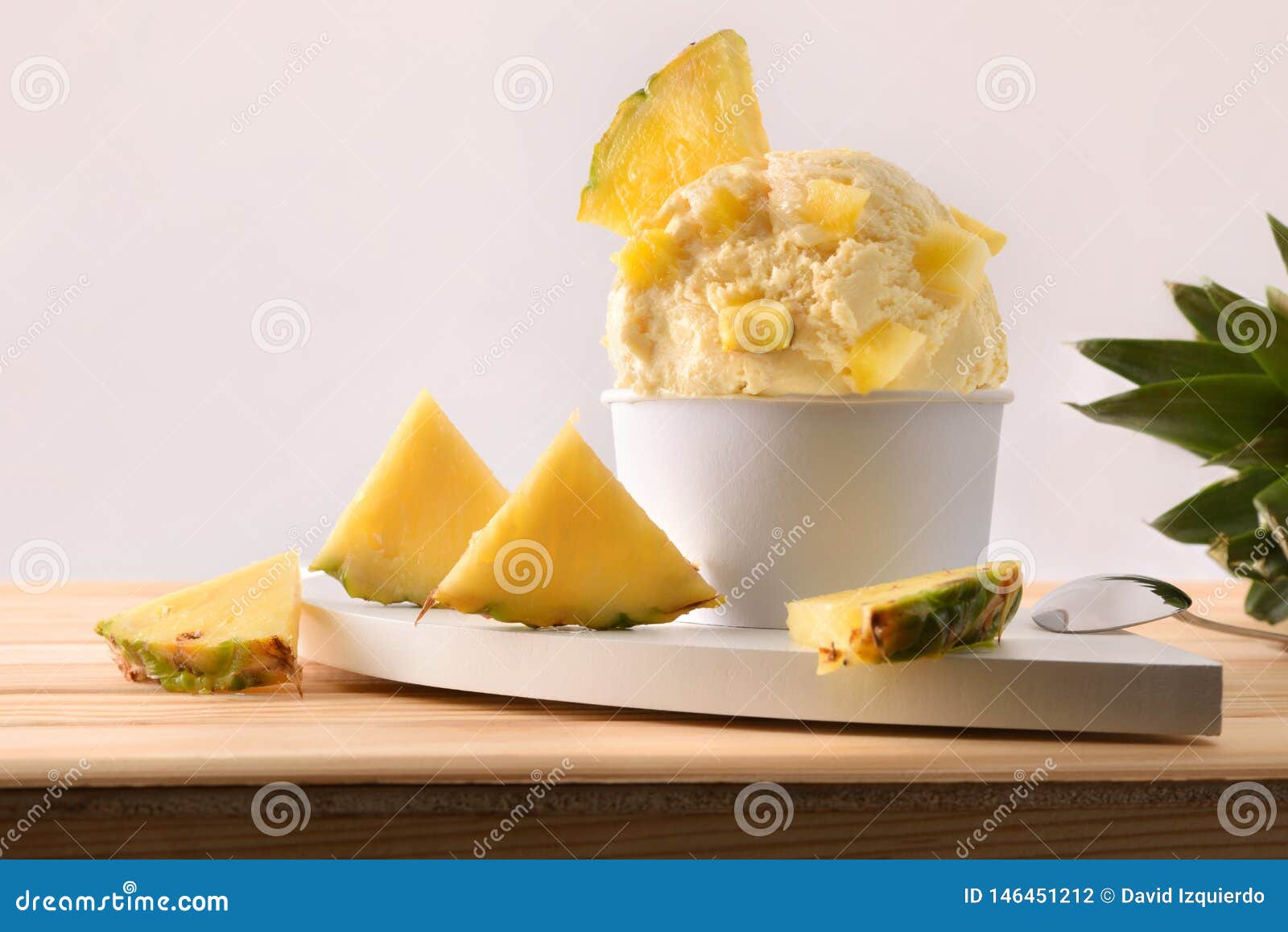 Pineapple Ice Cream Cup Decorated with Pineapple Chunks Stock Photo