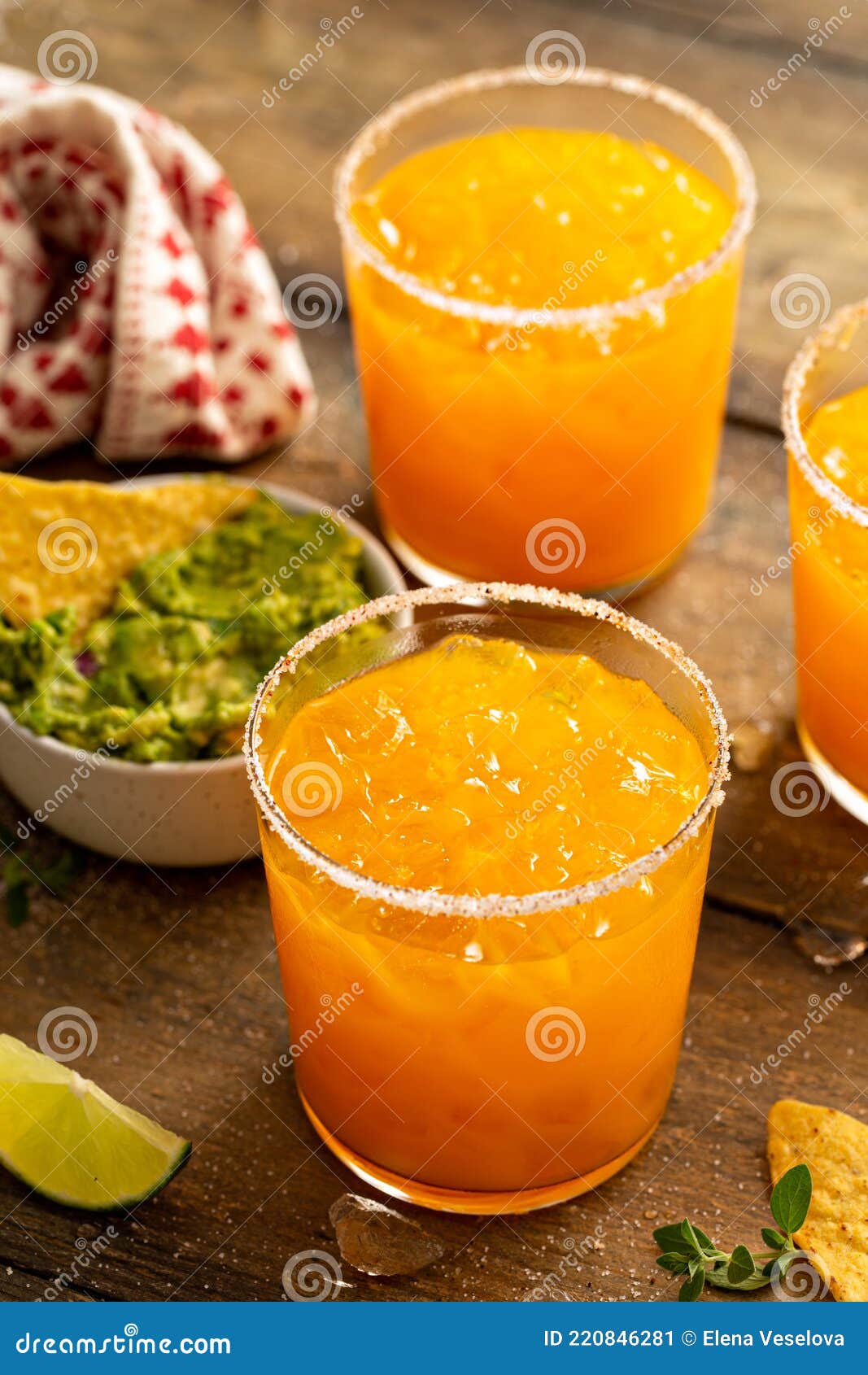 Pineapple and Mango Margarita with Chips and Guacamole Stock Image