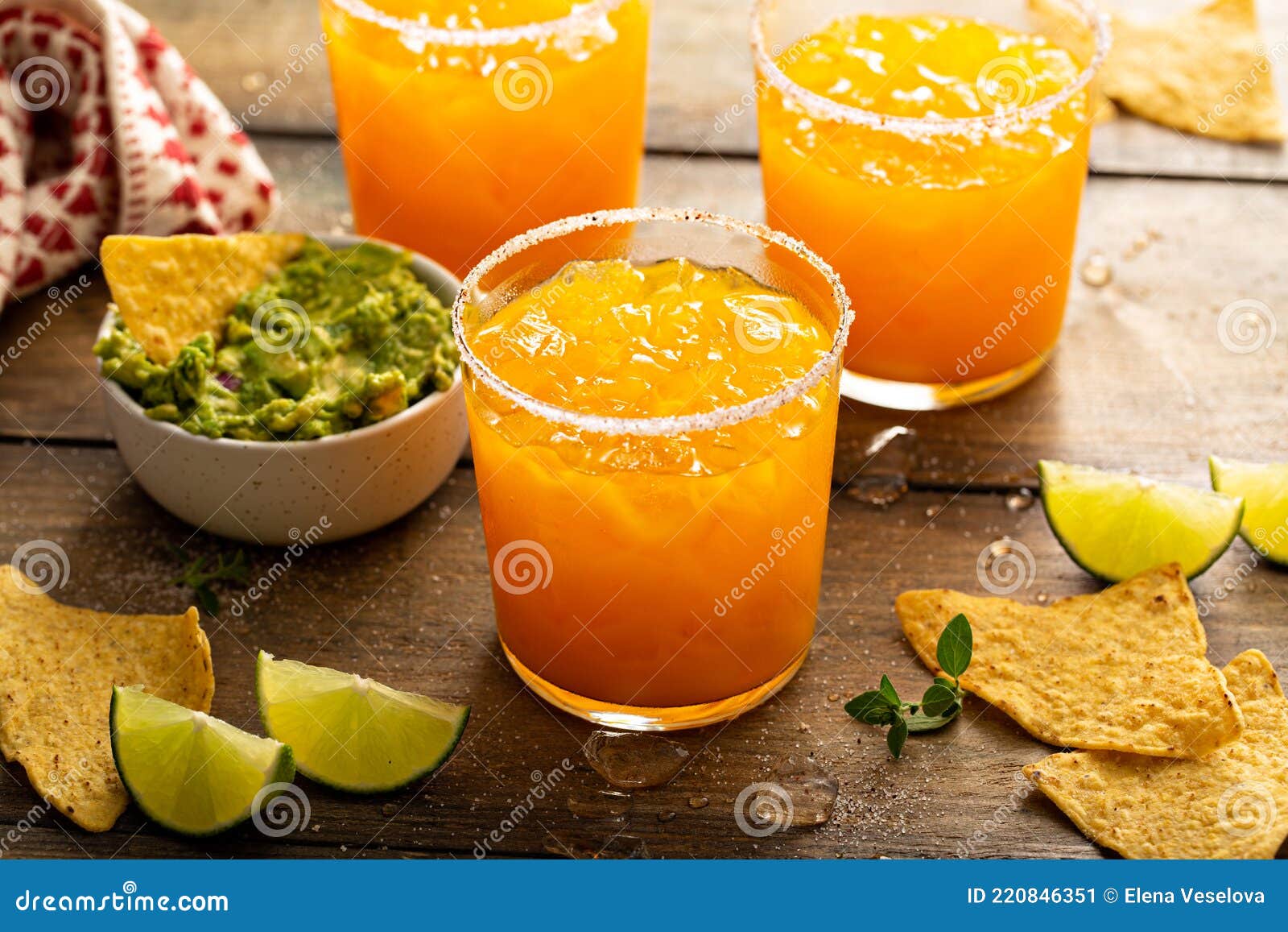Pineapple and Mango Margarita with Chips and Guacamole Stock Image