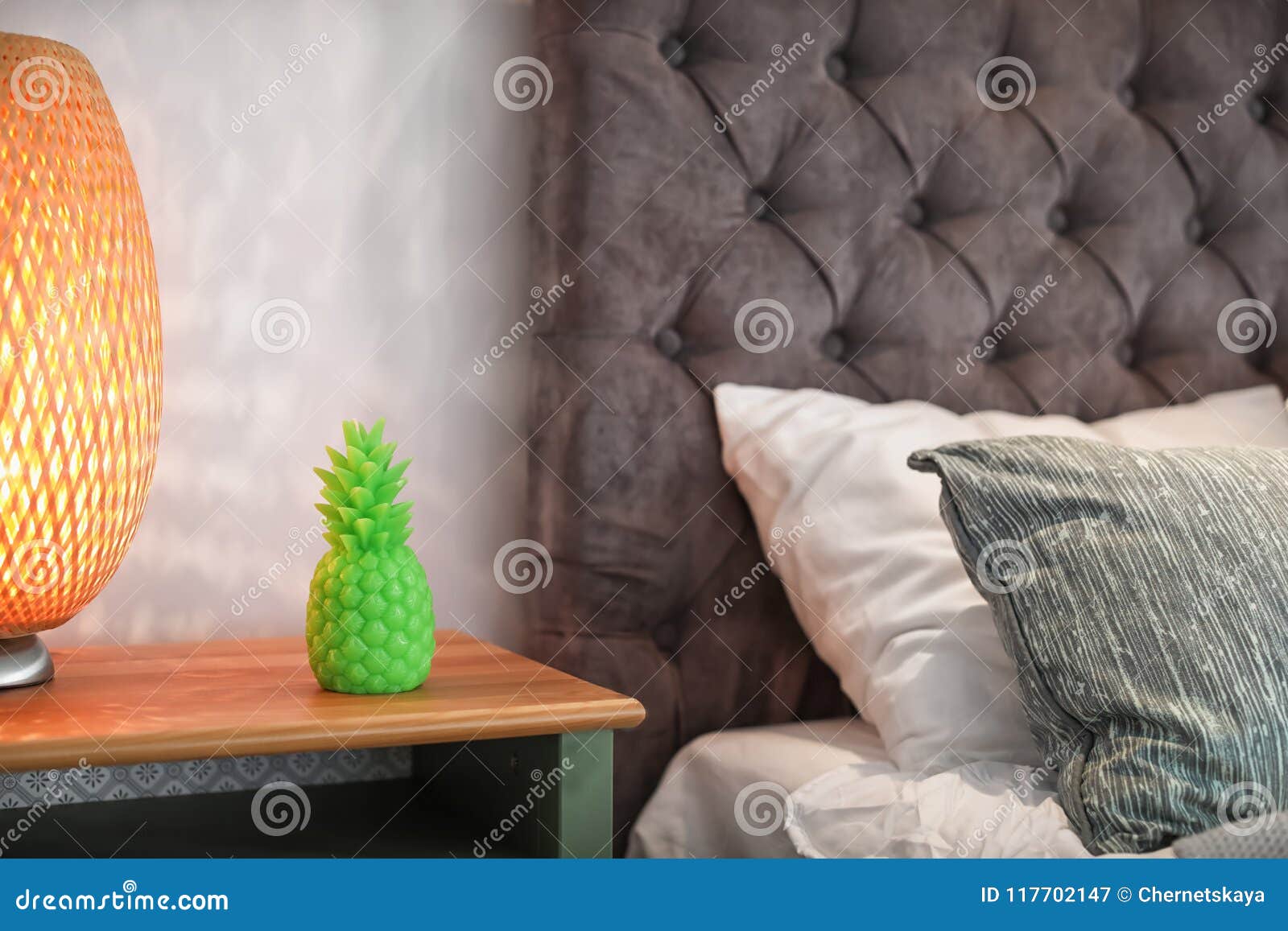 Pineapple Shaped Candle and Lamp on Bedside Table Stock Image Image