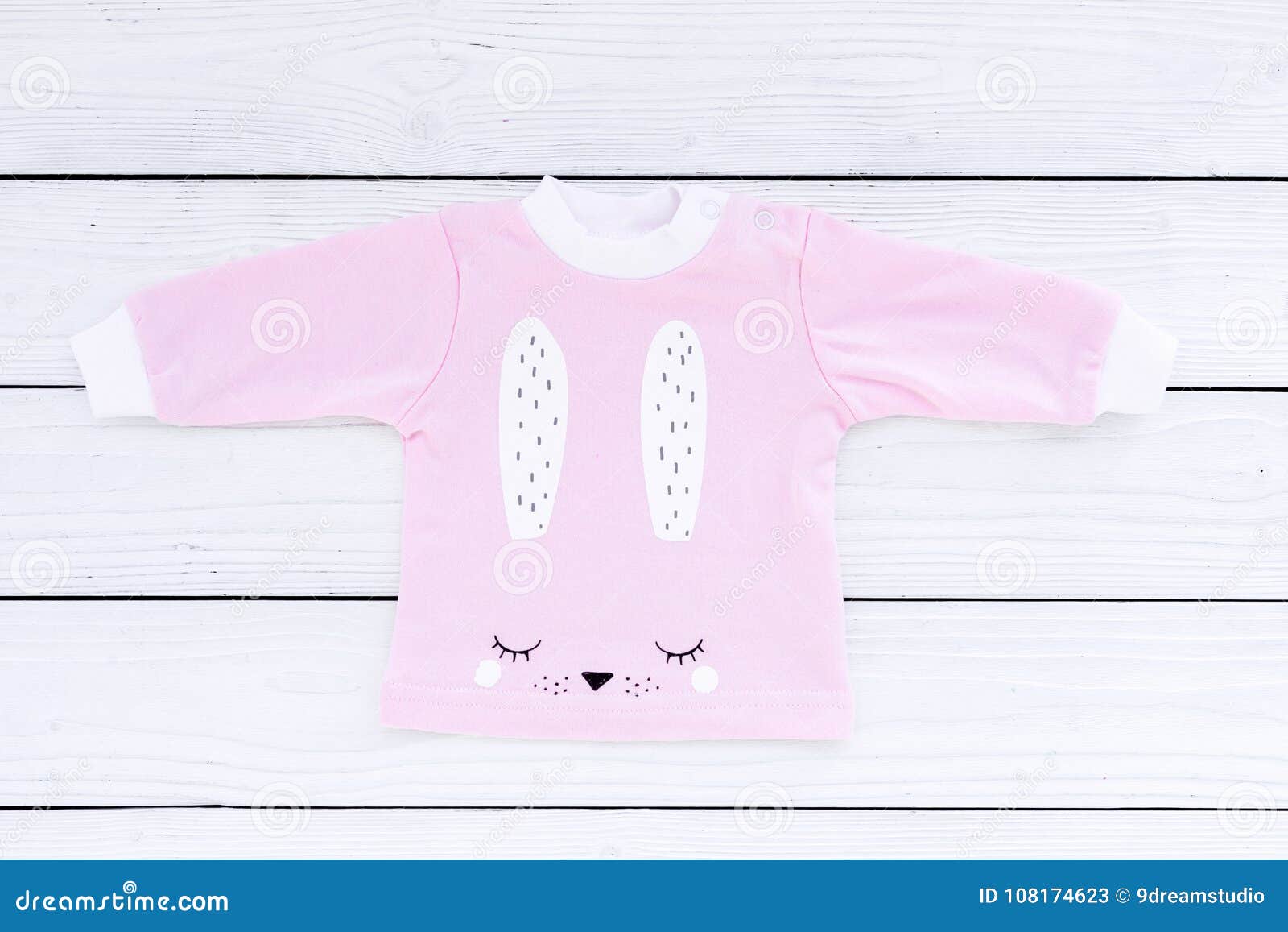 Pink Baby Clothes for Little Girl on White Wooden Background Top View ...