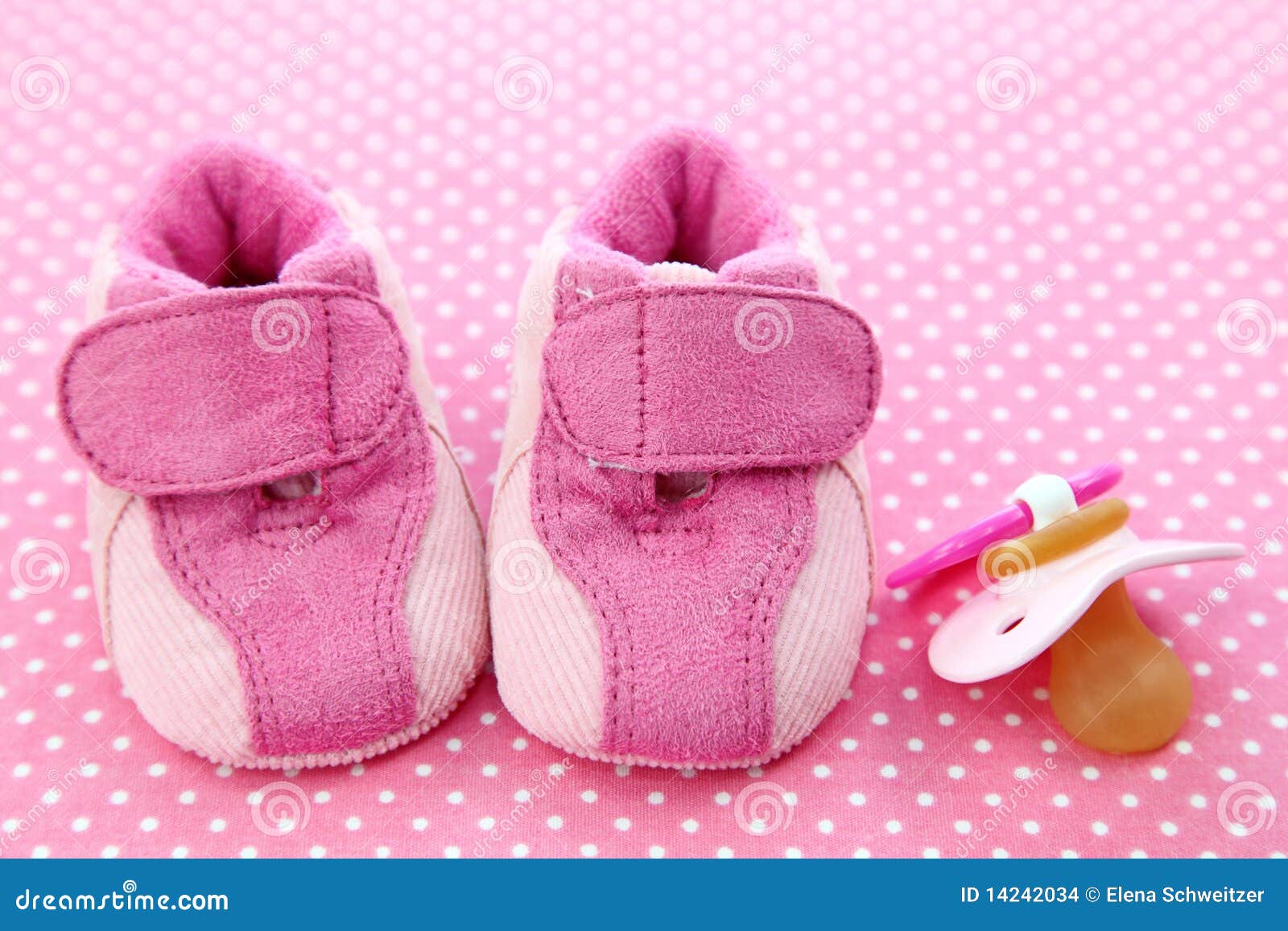 Pink baby shoes and dummy stock photo. Image of congratulation - 14242034