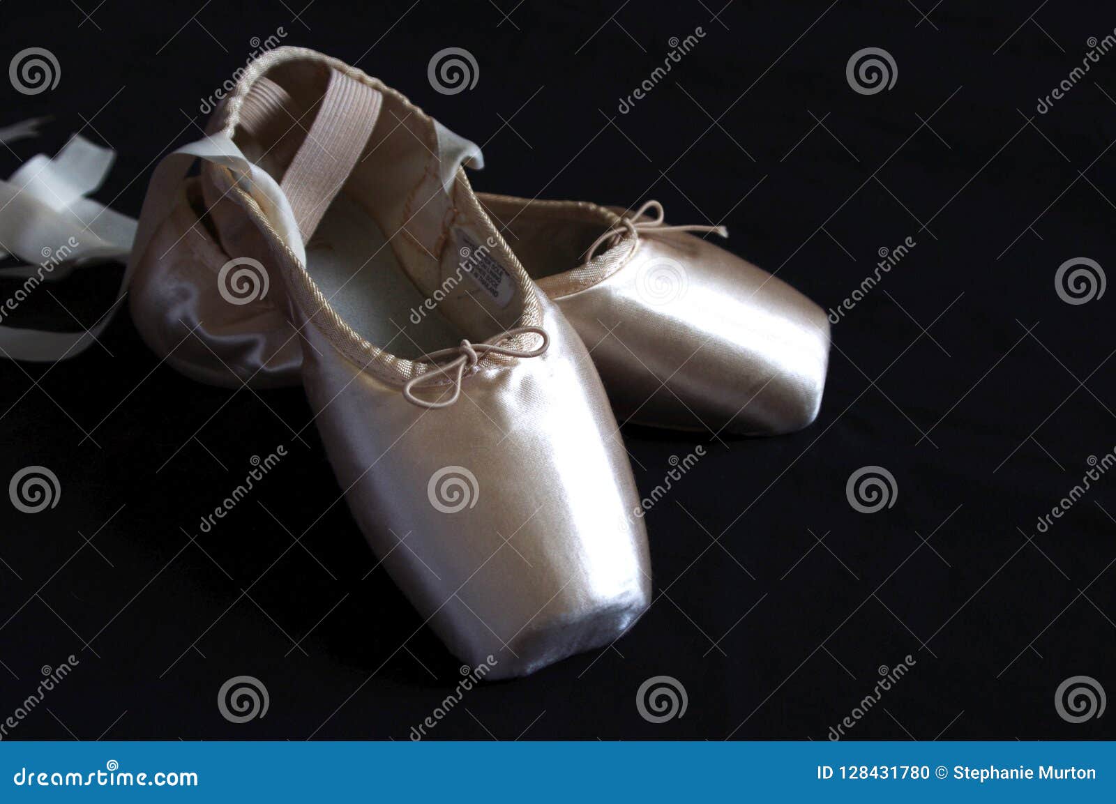 Pink Ballet Pointe Shoes with Ribbons on Black Background Stock Photo ...