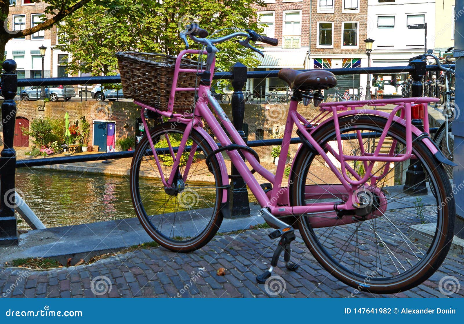 Pink bicycle on the bridge stock photo. Image of tourism - 147641982