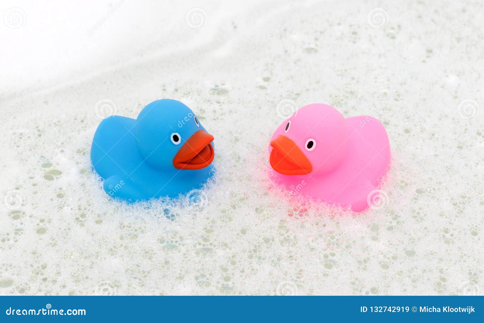 pink and blue rubber ducks