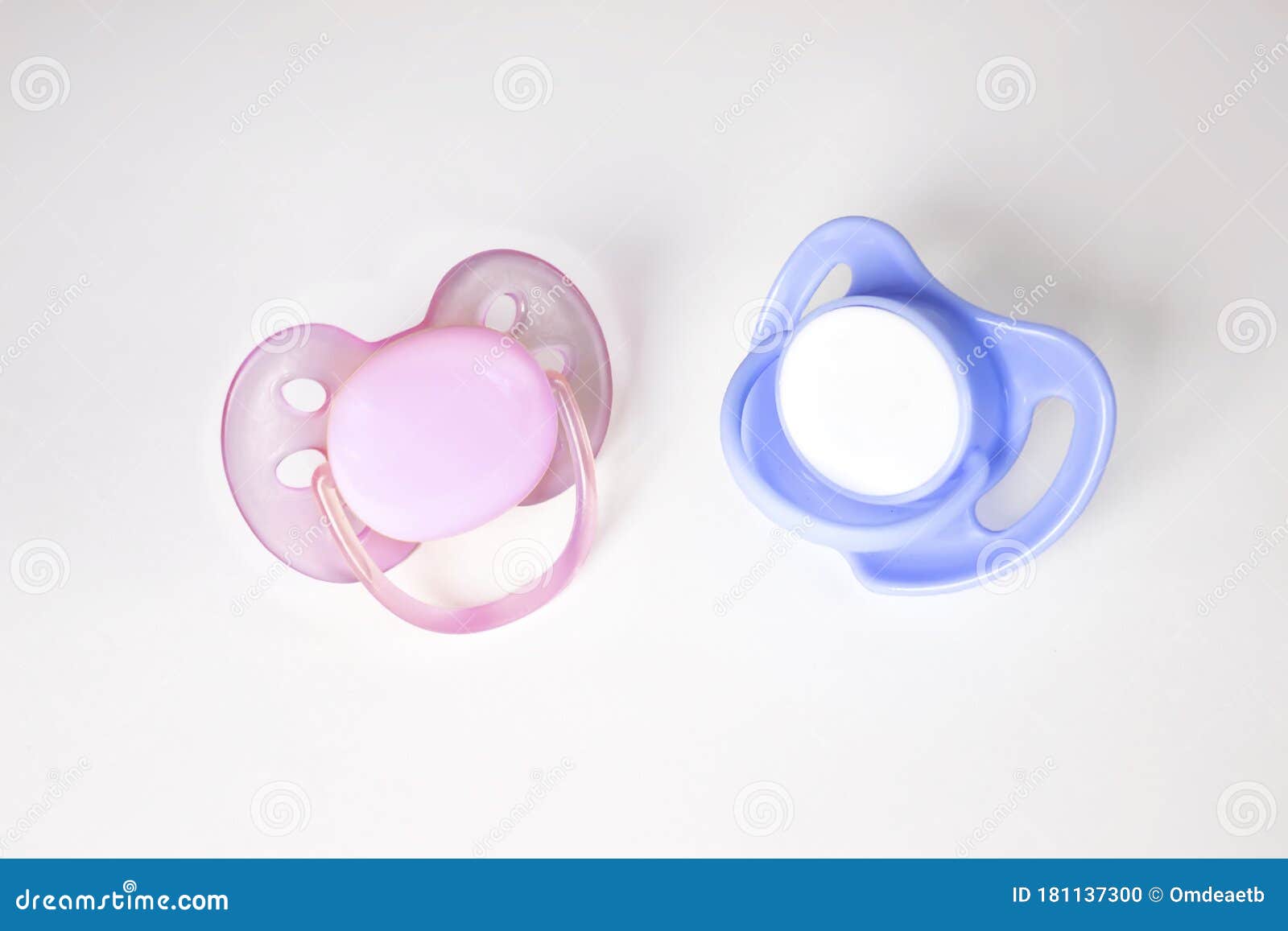 Pink and Blue Pacifiers on a White Background. Two Pacifiers Close-up ...