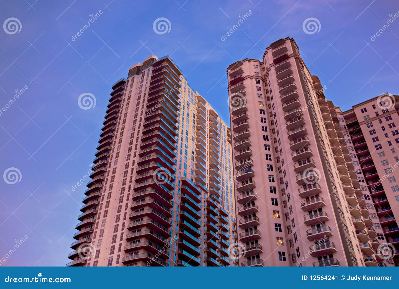Pink condo with blue sky stock image. Image of high, modern 12564241