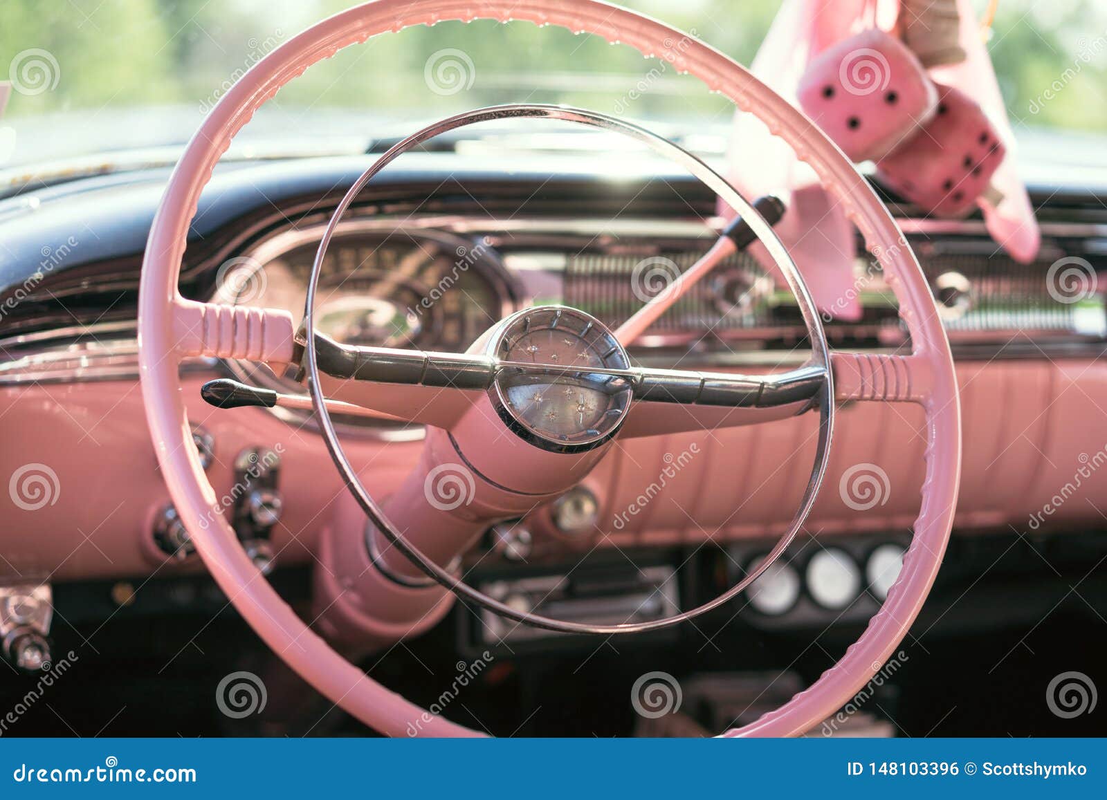 The Pink Dashboard and Steering Wheel of a Classic Car Stock Photo