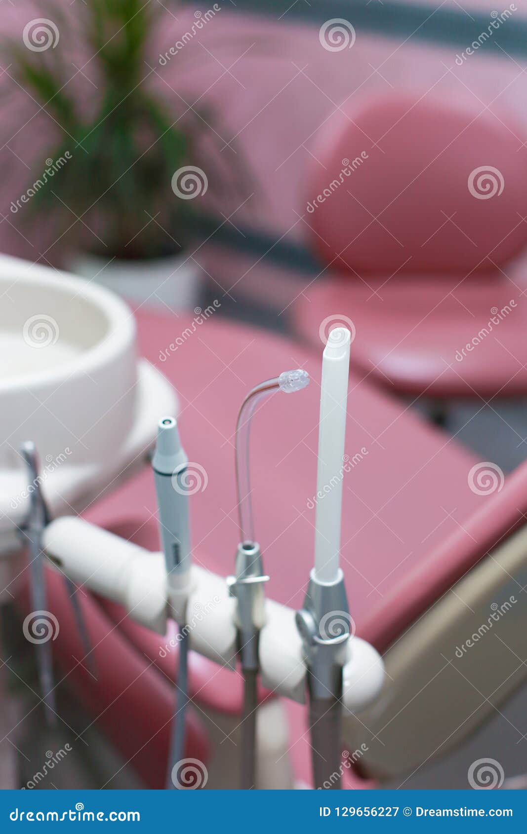 Pink dentist workplace stock image. Image of chairs 129656227