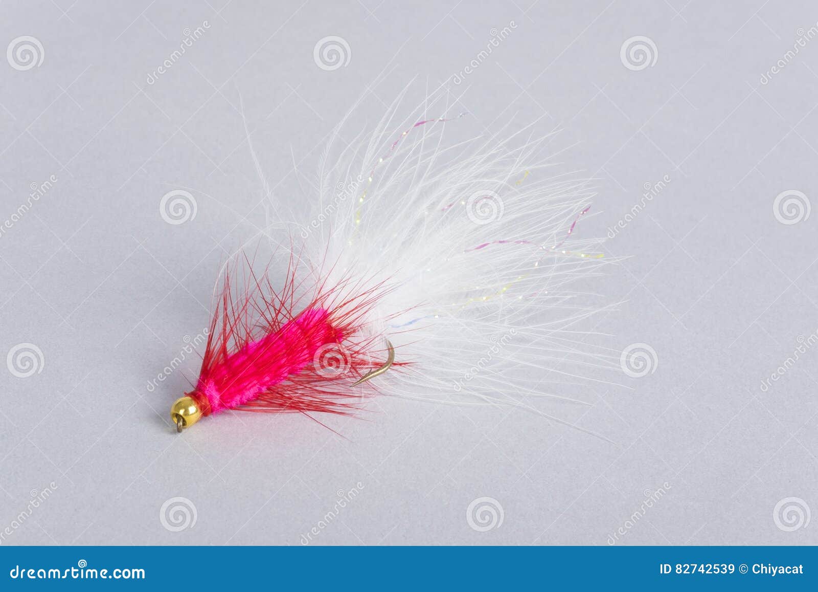 Pink Fishing Fly on Gray stock image. Image of colorful 82742539