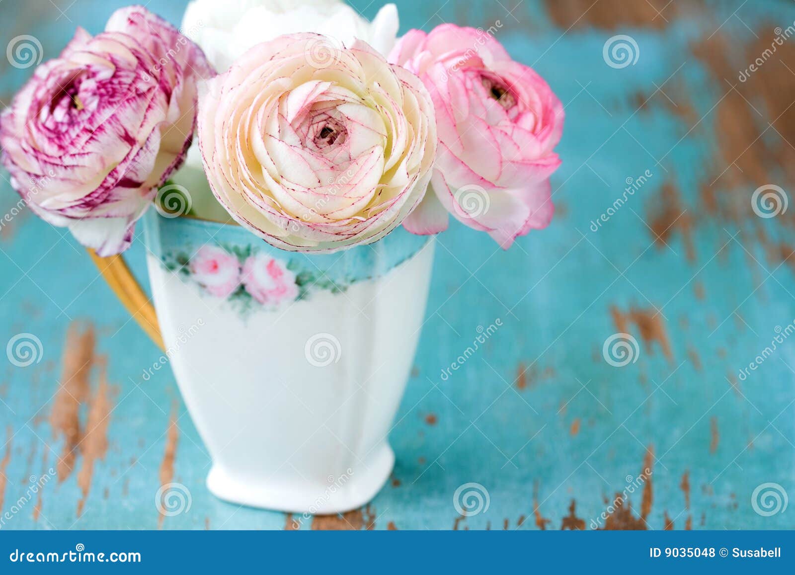 pink flower in teacup