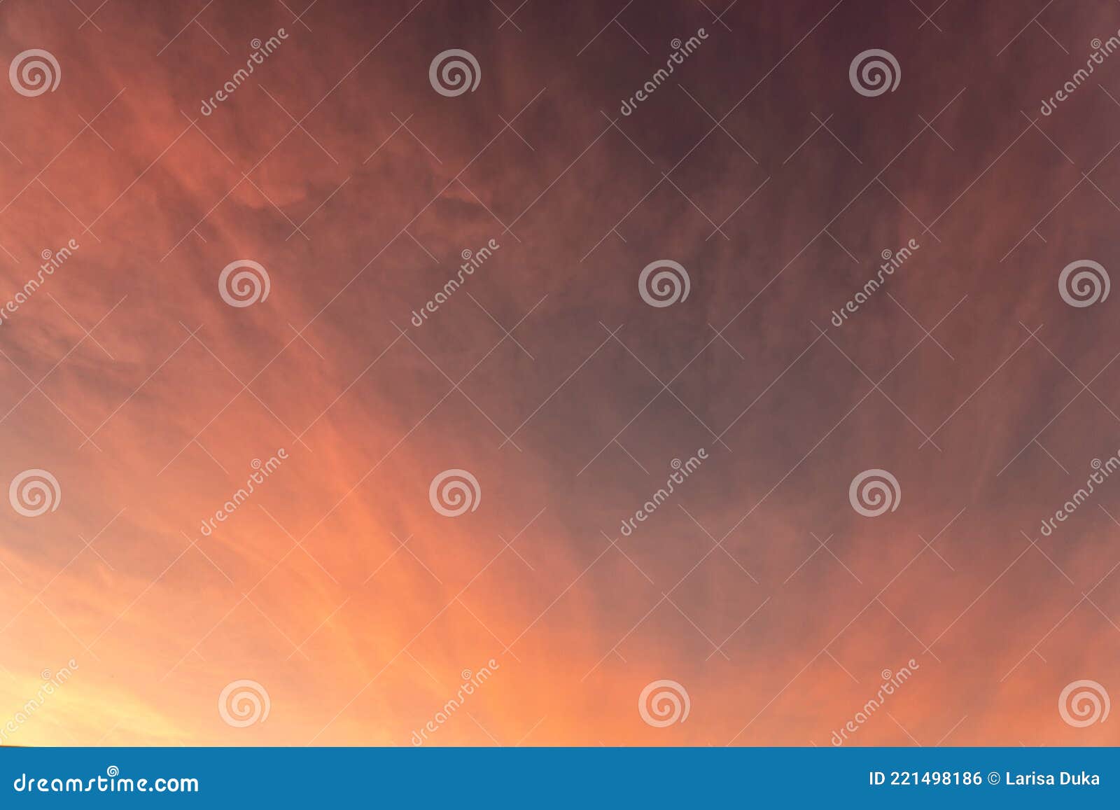Pink and Gold Clouds and Sky at Sunset on Summer Evening Stock Photo