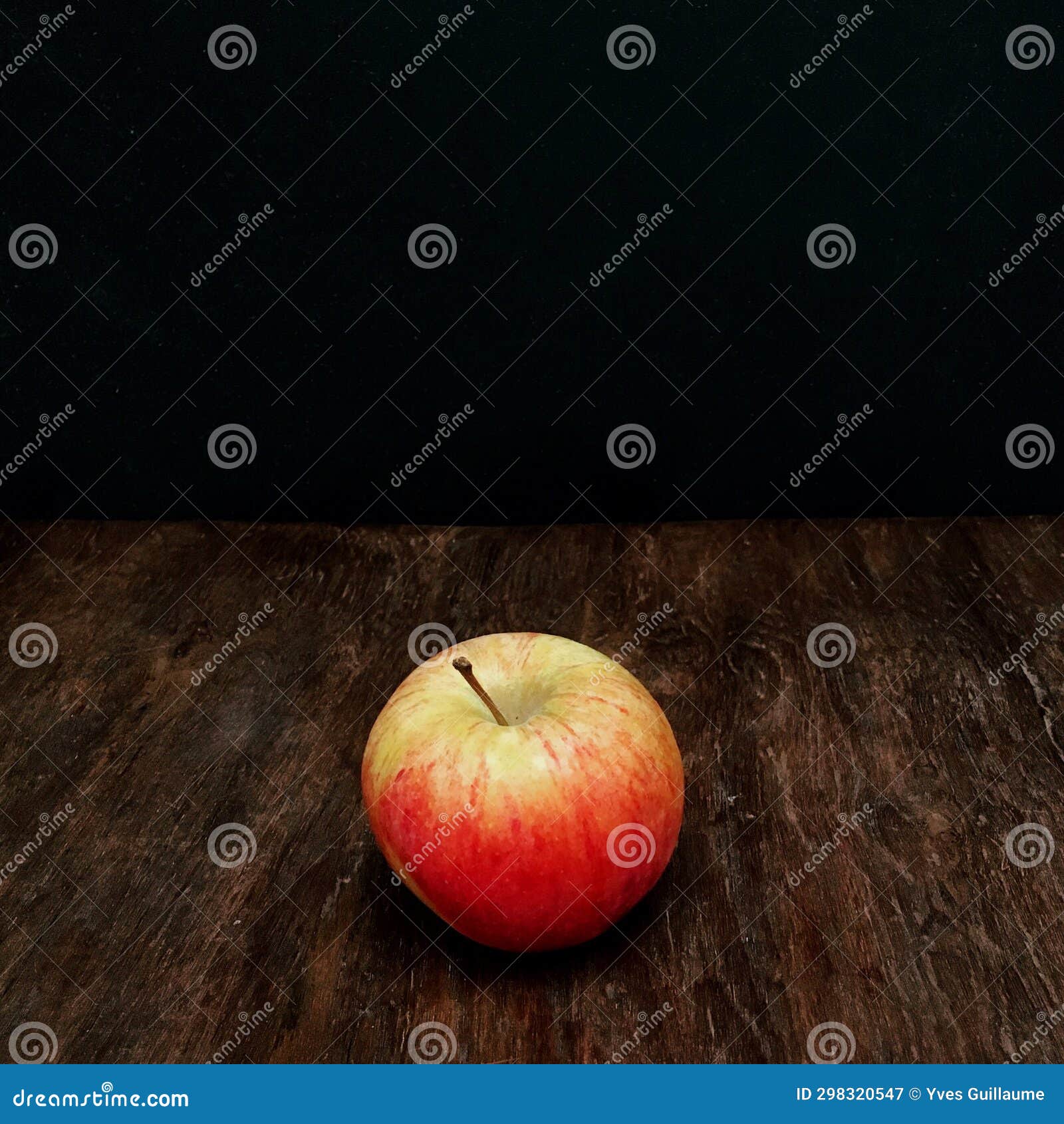 pink lady apple on table