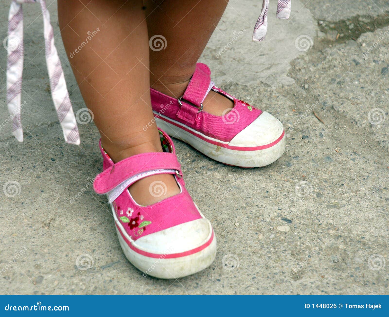 Pink little girls shoes stock photo 