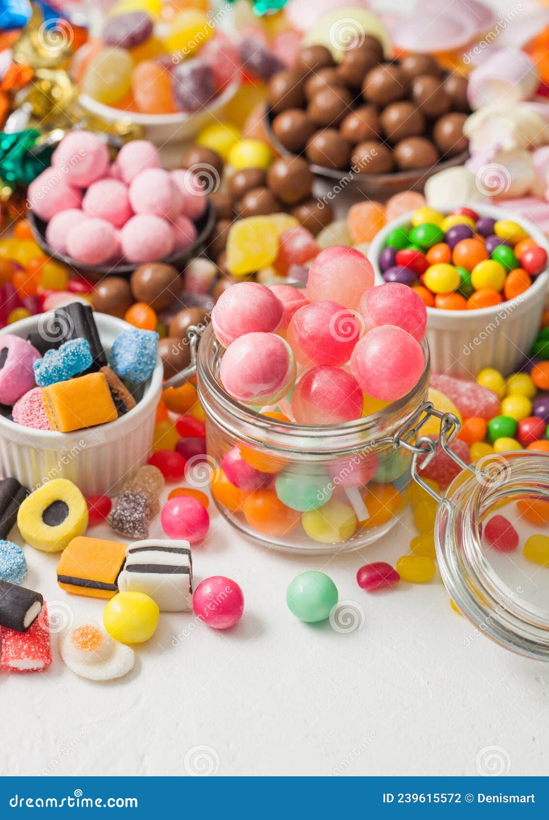 Pink Lollipop Candies in Jar with Various Milk Chocolate and Jelly Gums ...