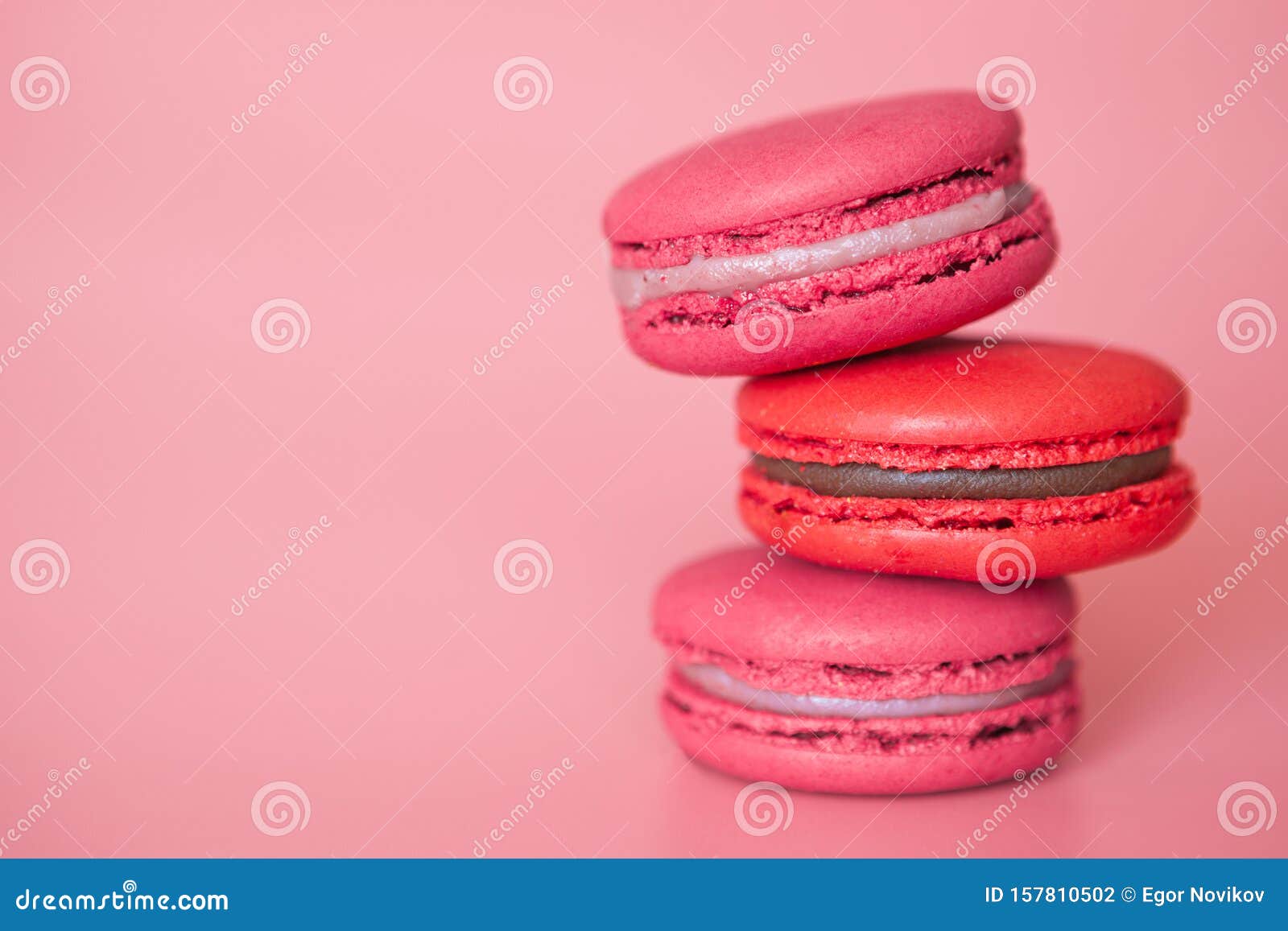 Pink Macaroons in a Stack on a Fashionable Coral Background Close-up ...