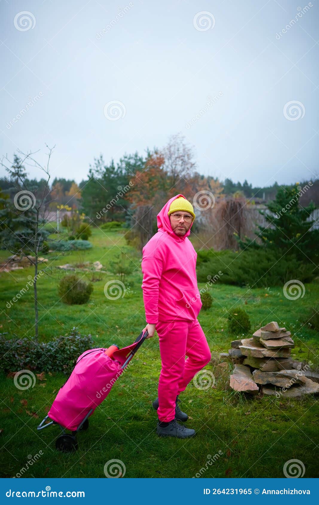 Pink Man Posing Outdoor in Pink Sport Suit with Rolling Bag. Pink Suit ...