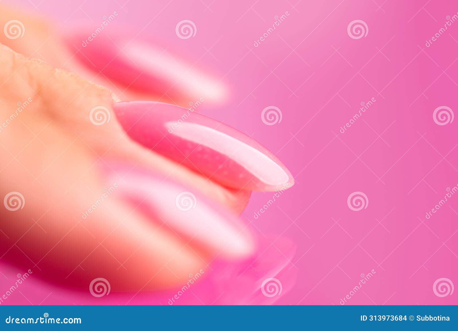 pink nail polish on woman nails, shellac uv gel, varnish, manicure concept in beauty salon