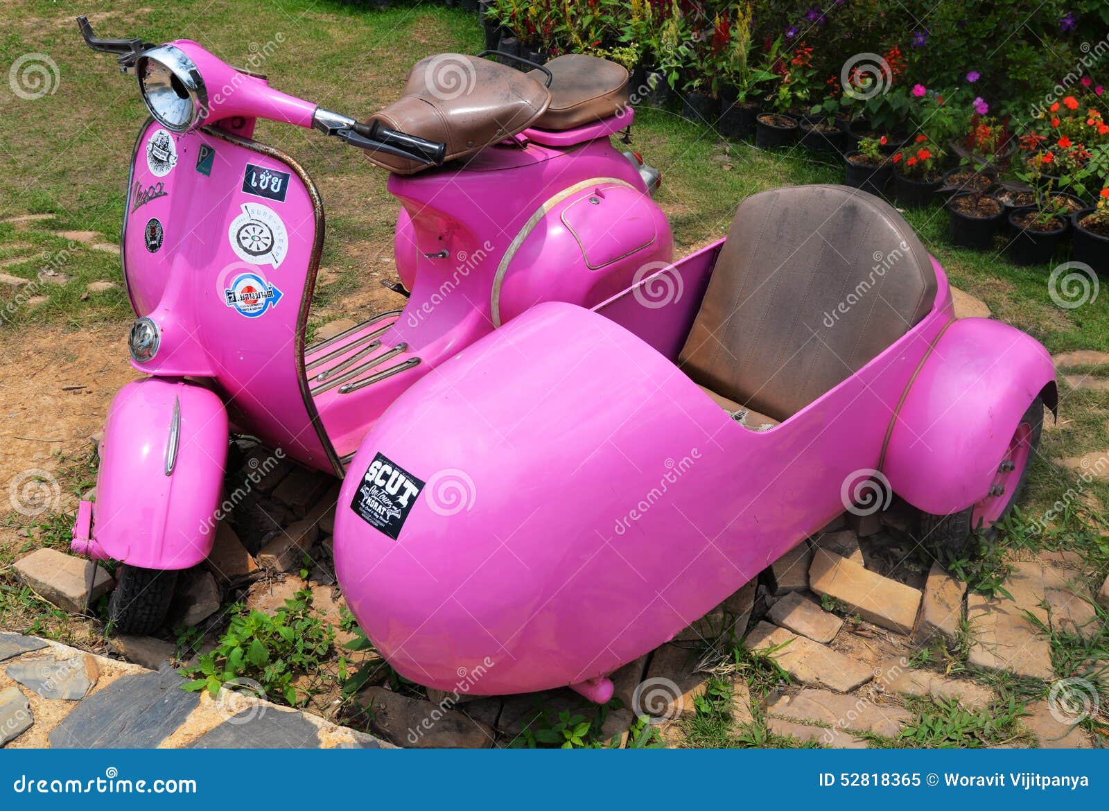 pink vespa with sidecar