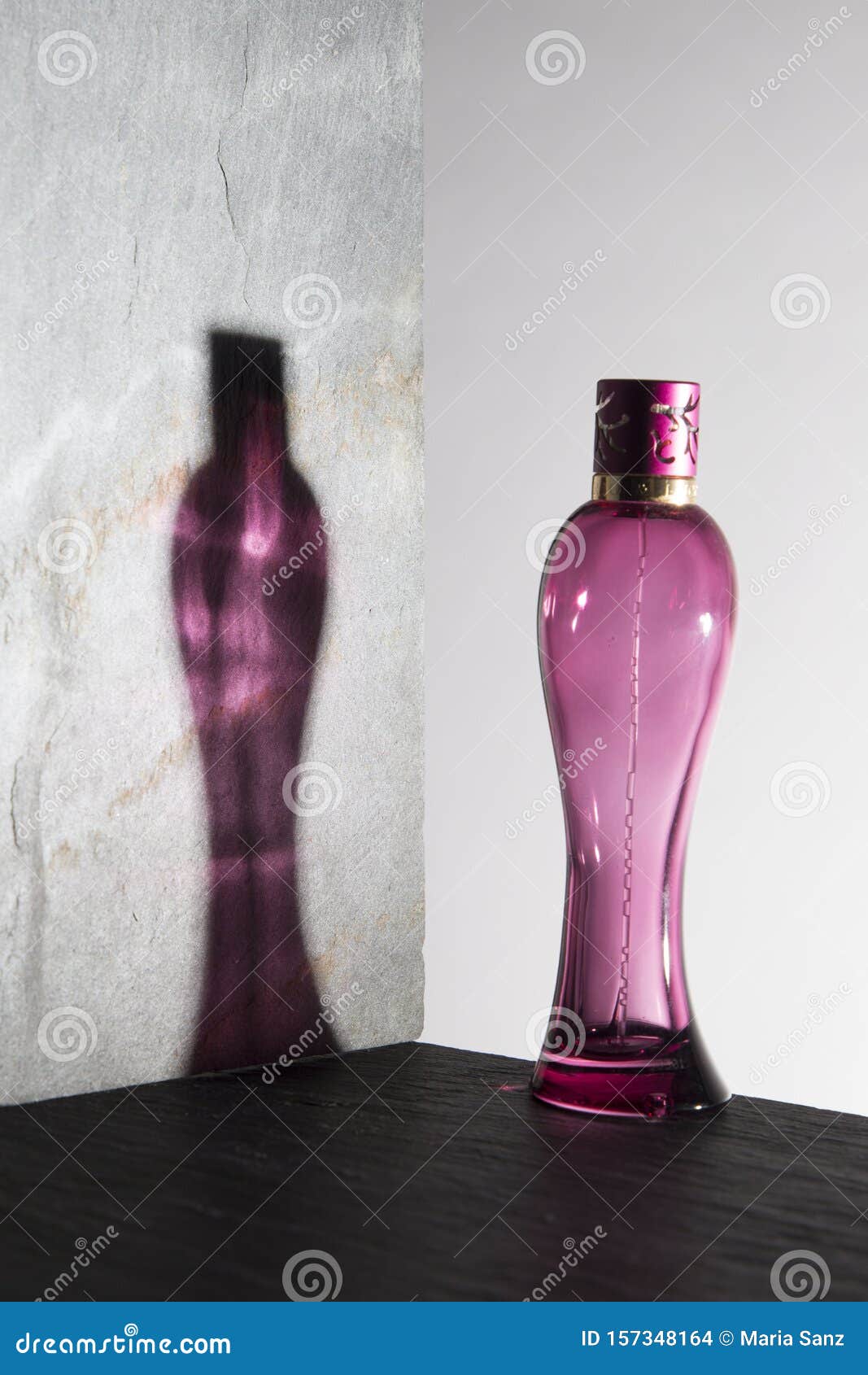 pink perfume bottle on white background