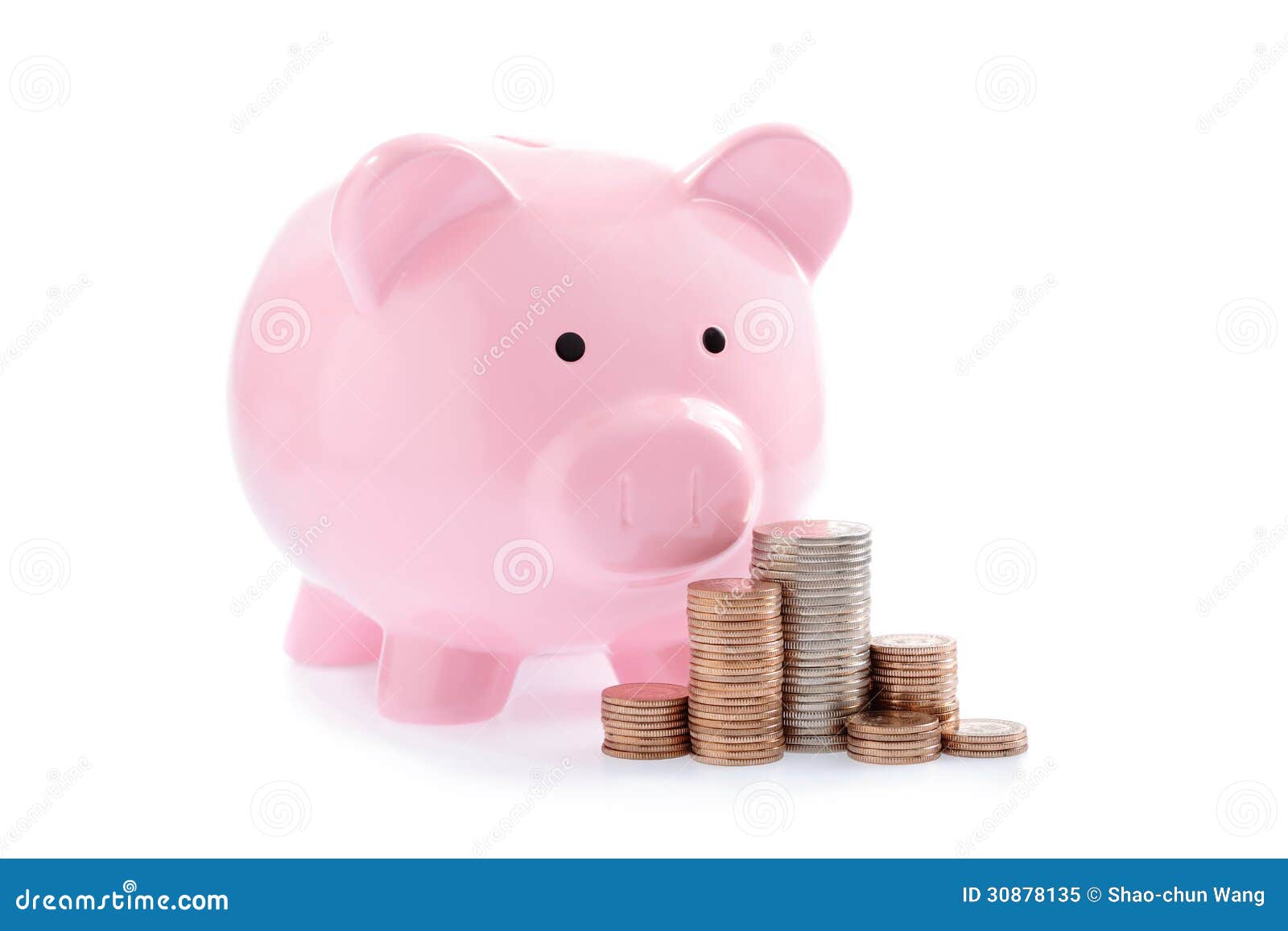 pink piggy bank and stacks of money coins
