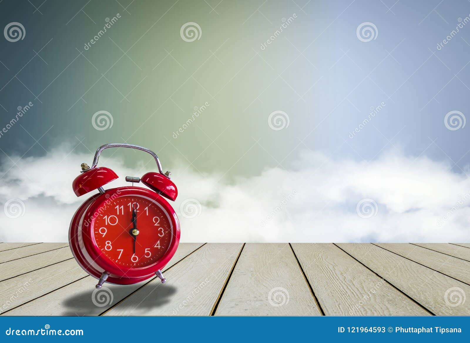 pink retro alarm clock, wood table, pale blue background