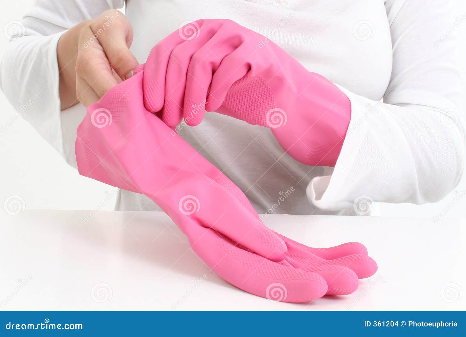 Pink Rubber Glove For Cleaning With The Palm Up And Next To The