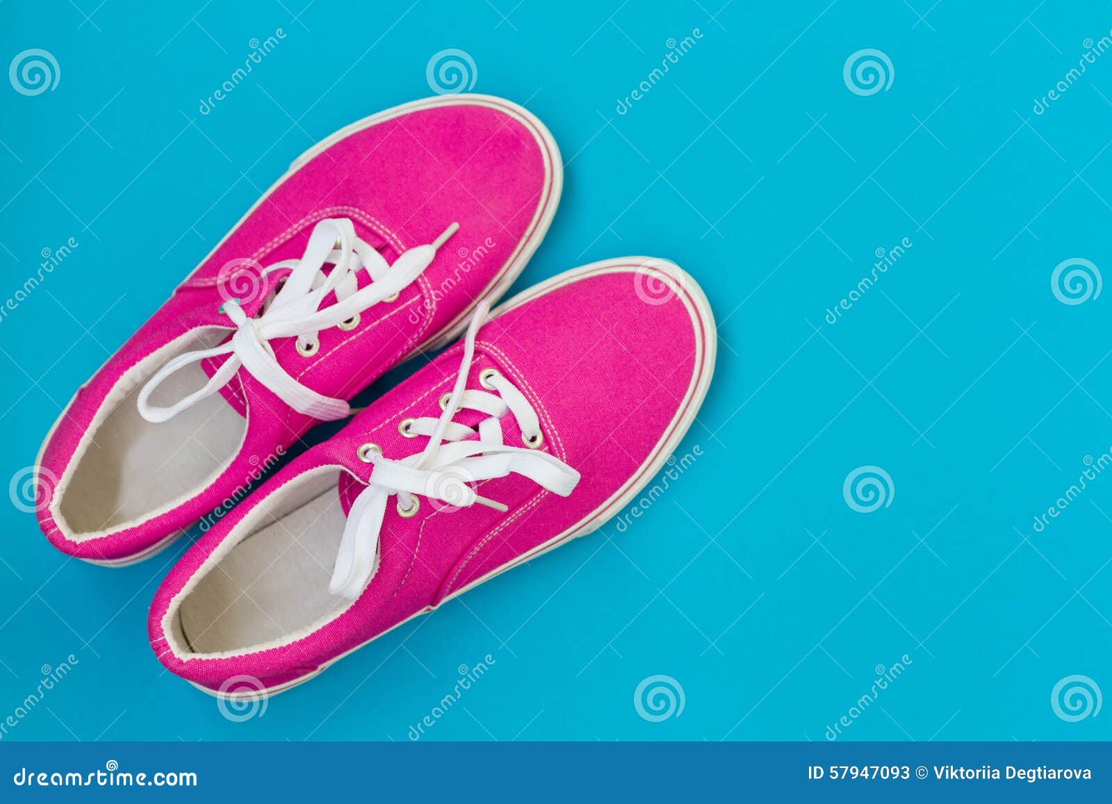 Pink Sneakers with Laces on a Blue Stock Image - Image of laces ...