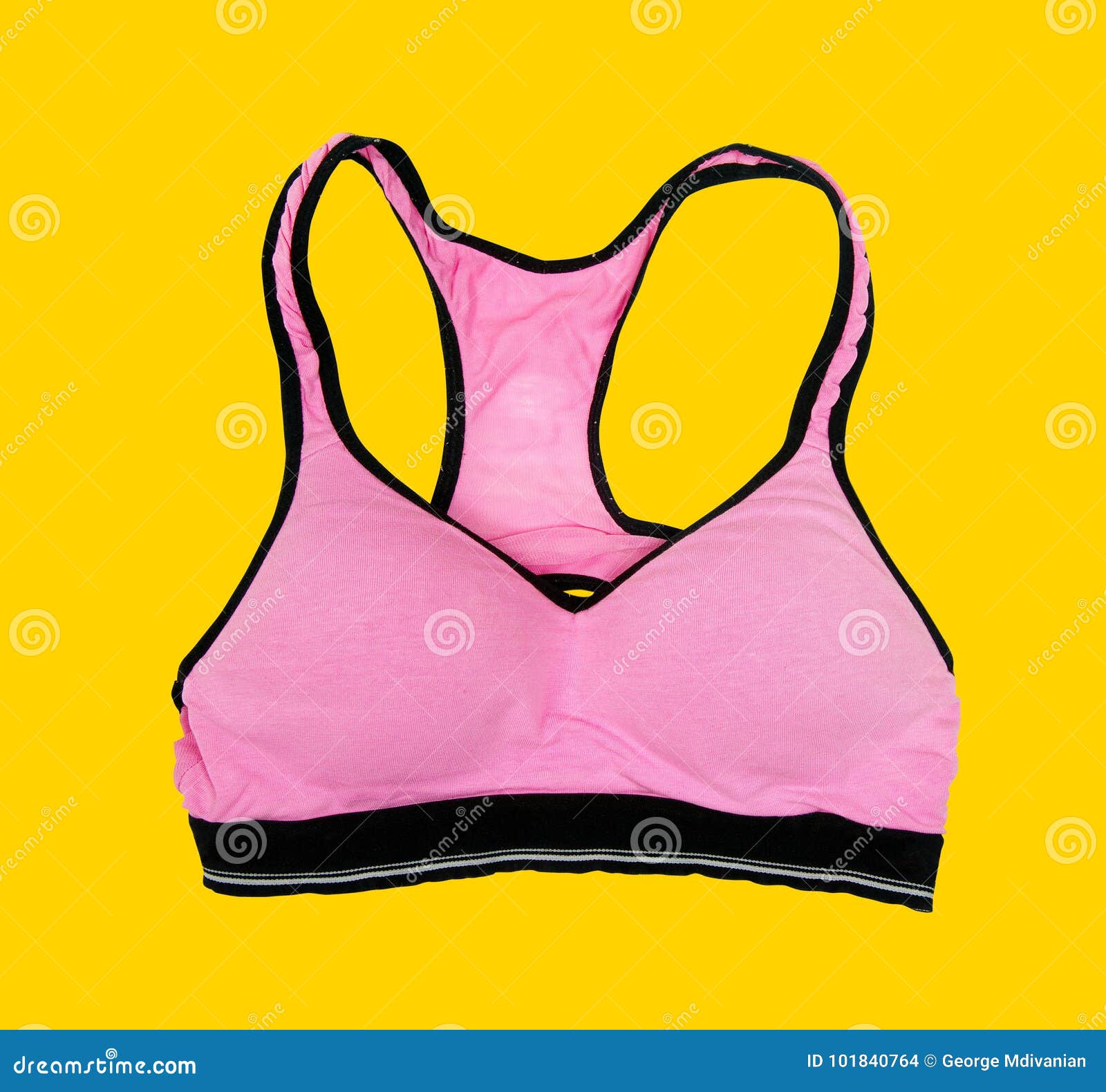 Pink sporty bra on yellow stock photo. Image of passion 101840764