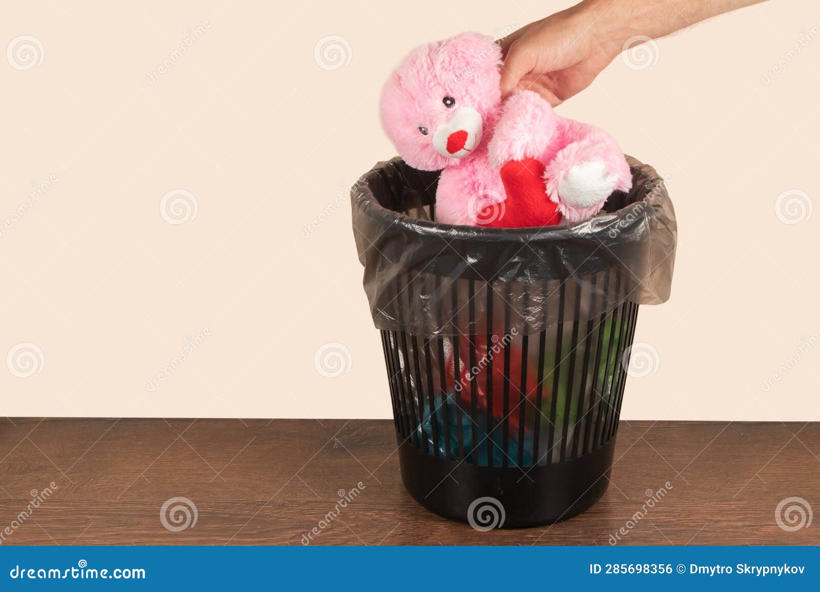 Pink Teddy Bear with Heart Throw in the Trash Can Stock Photo Image