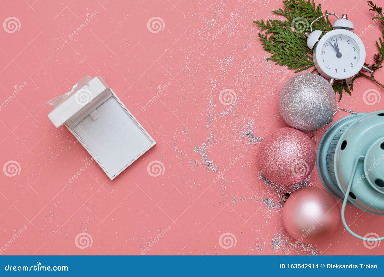 pink top view flatlay with pink and silver decor and clock. christmas holiday. copy space