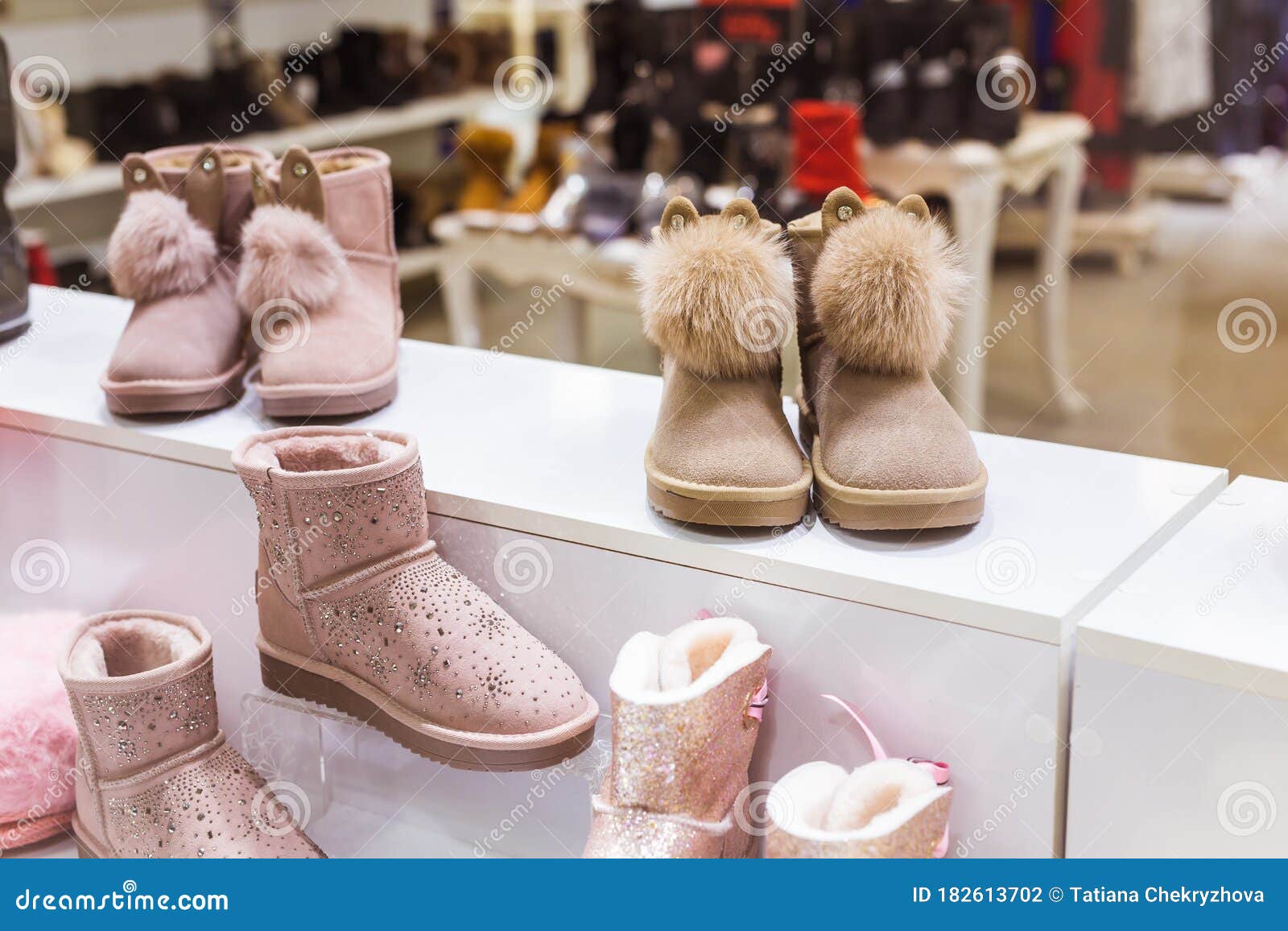 Pink Ugg in the Shop Window, Female Winter Warm Shoes. Winter Clothes ...