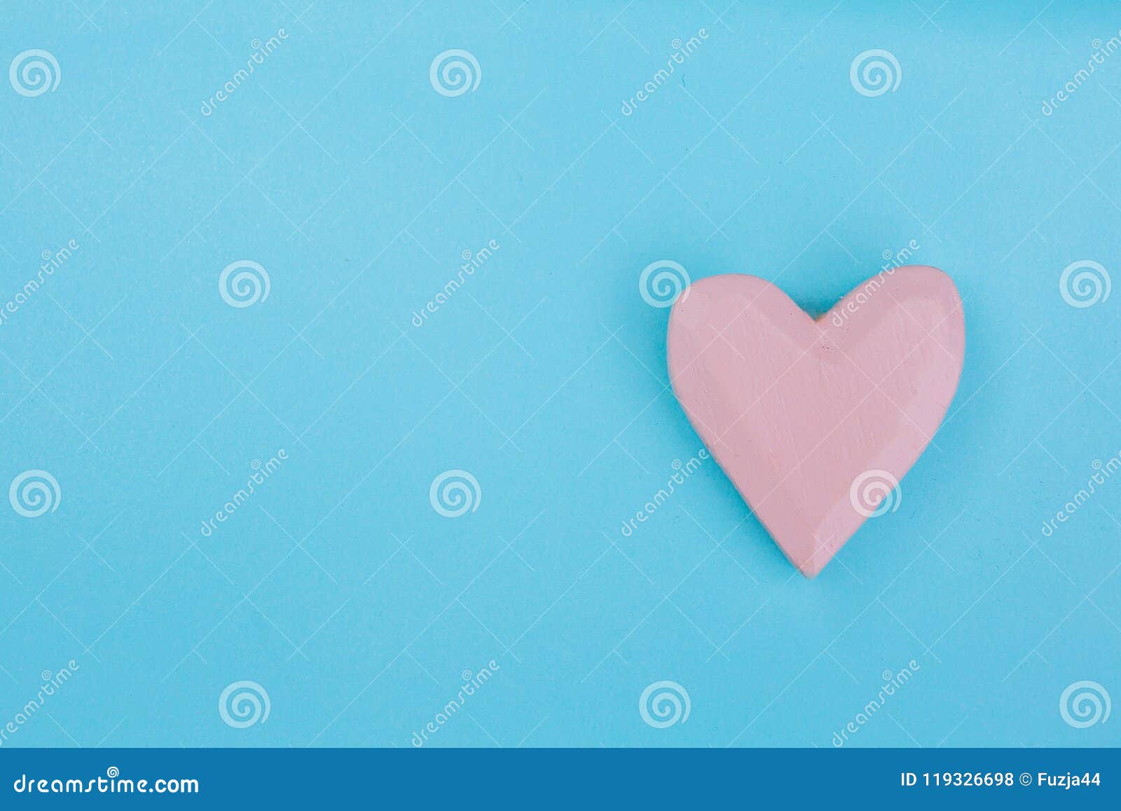 Patterns And Designs Of Green Wooden Heart On Blue Background With