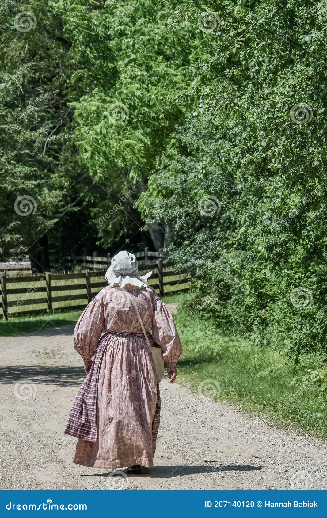 Pioneer Woman Walking Down Road Editorial Image - Image of world