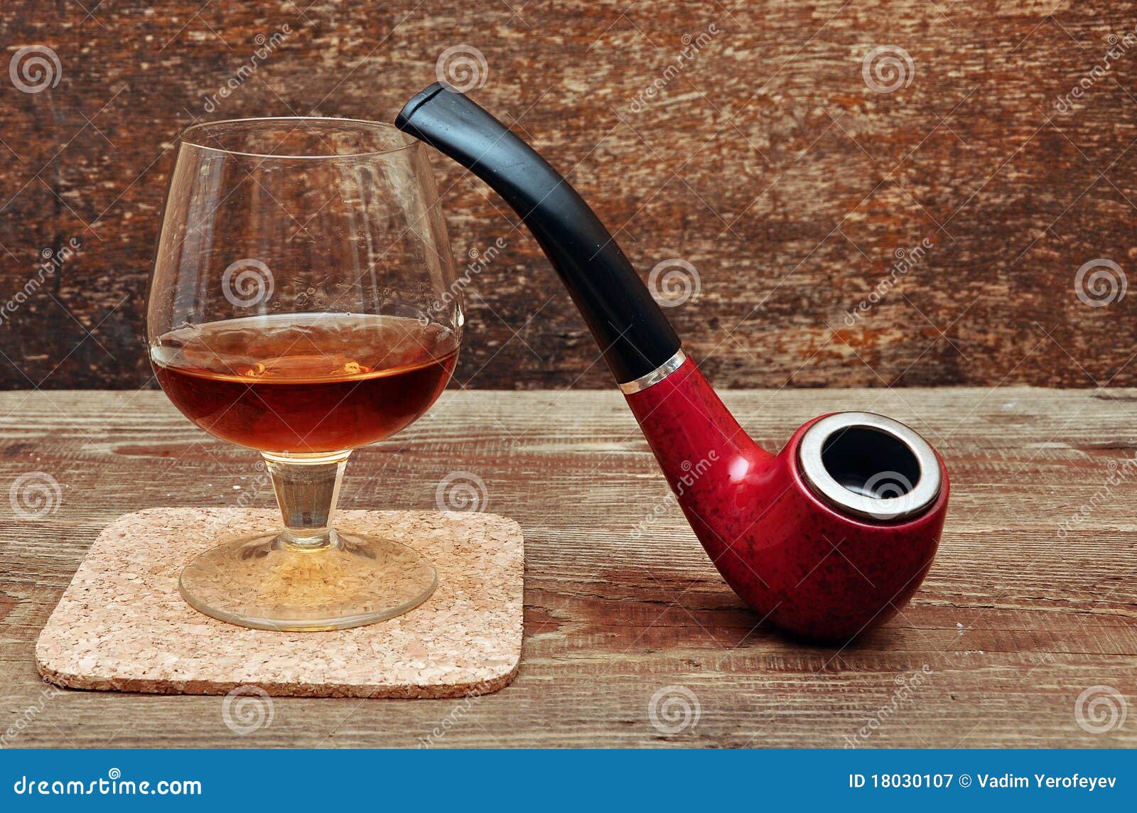 Pipe and glass of cognac stock image. Image of cognac 18030107