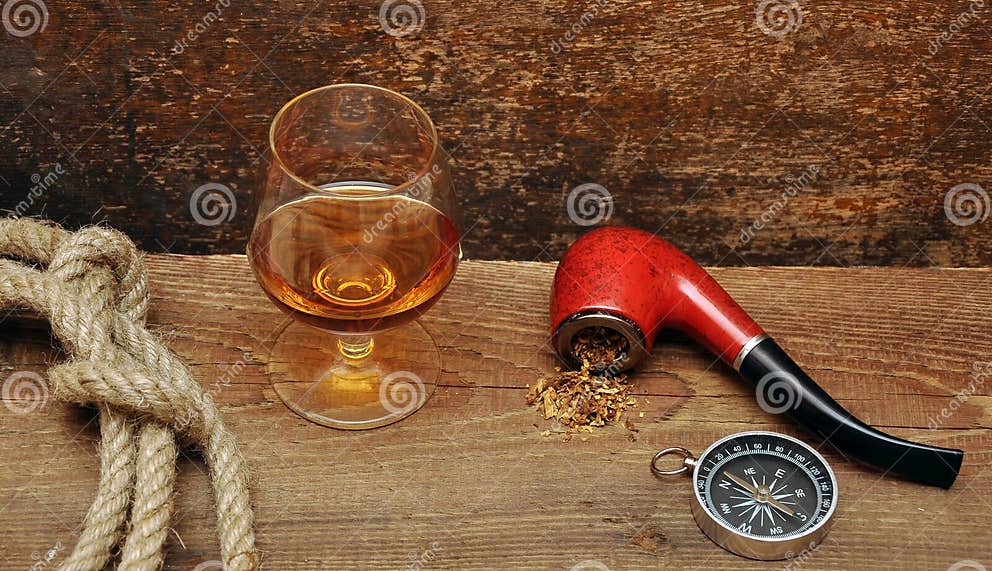 Pipe and glass of cognac stock photo. Image of rope, liquid 18030294